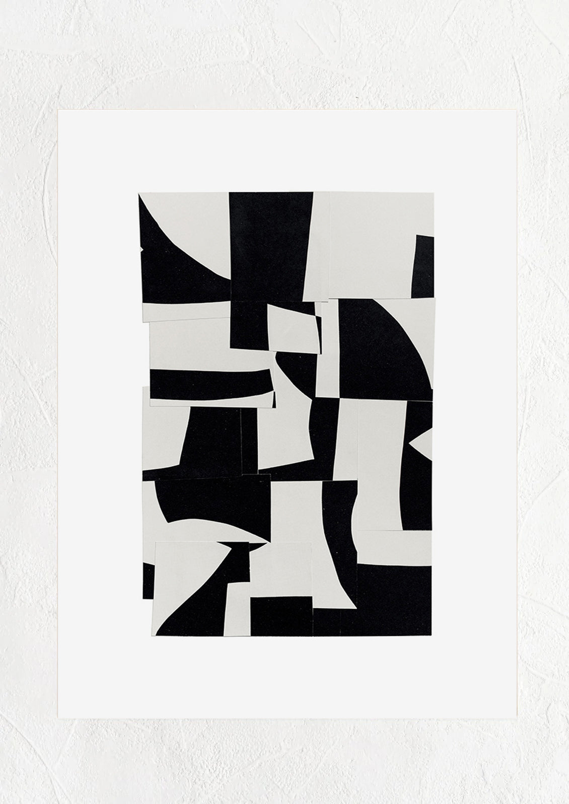 A black and white abstract art print with pieces of paper layered together.