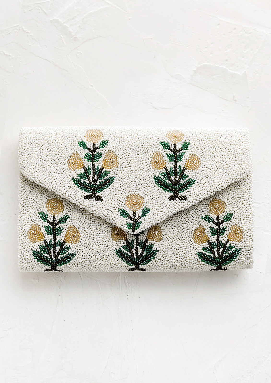 A beaded clutch in floral pattern and envelope silhouette.