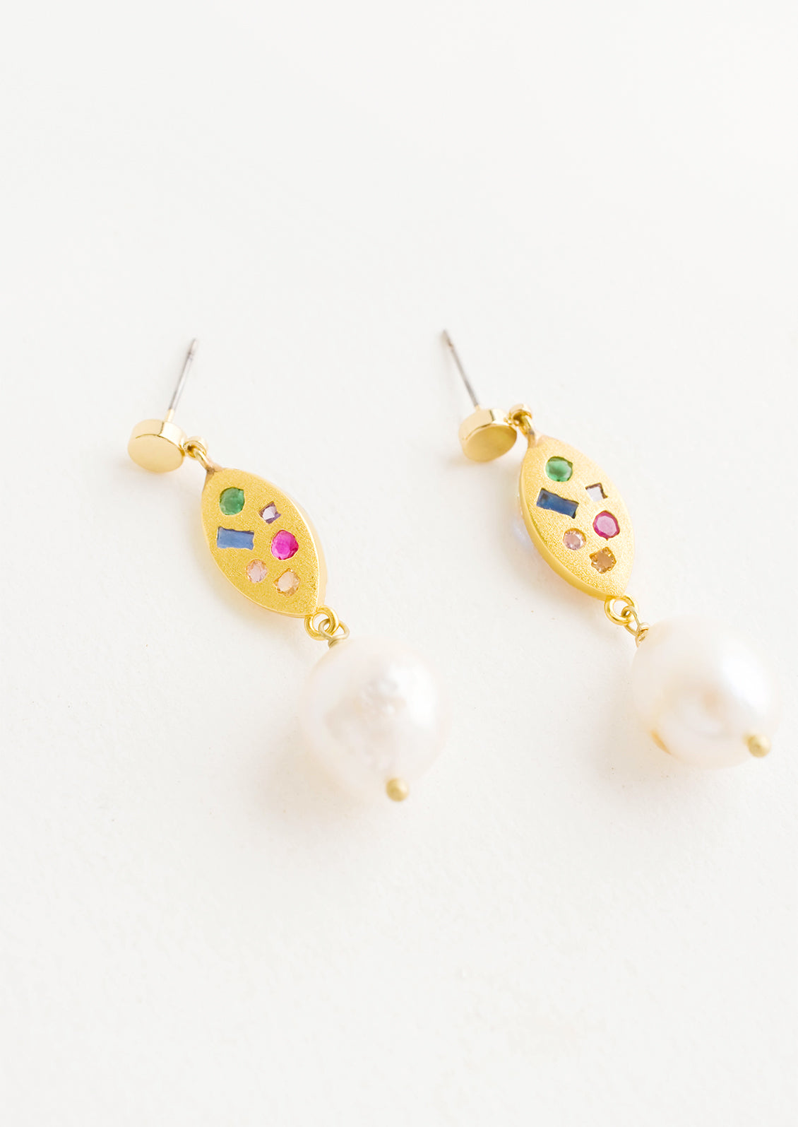 Dangle earrings with round gold post, gold baguette middle with embedded gemstones, pearl bead bottom