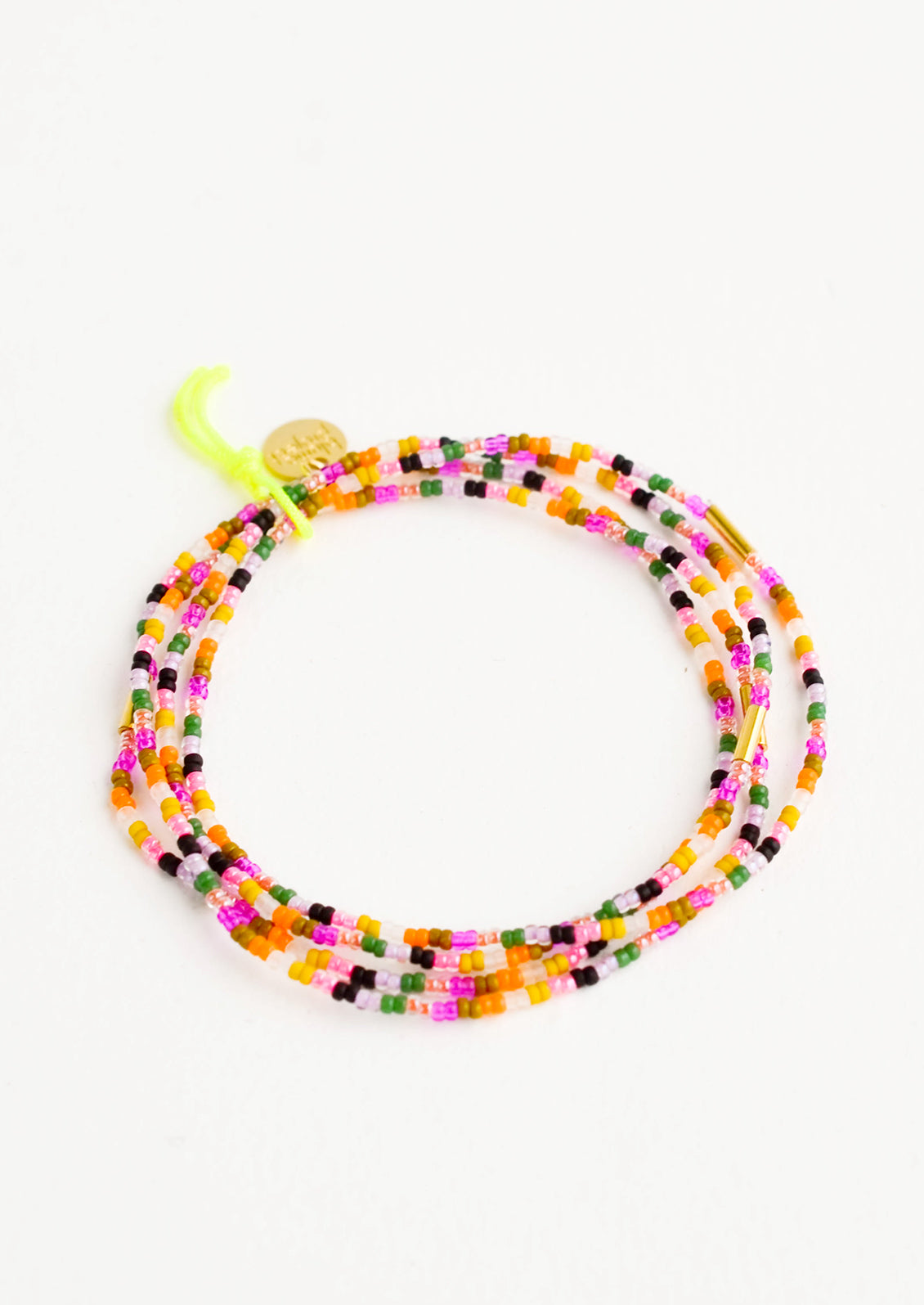 Set of four colorful glass seed bead bracelets with brass accent bead