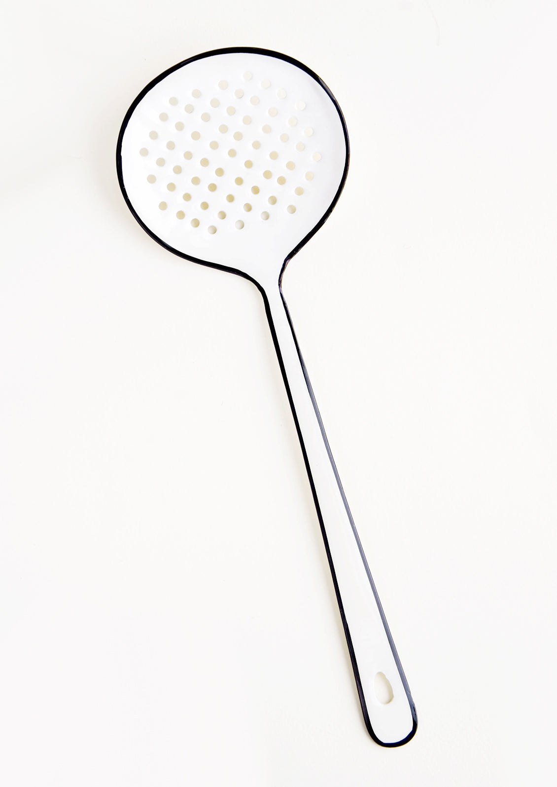 Enamel strainer utensil in white with painted black edging