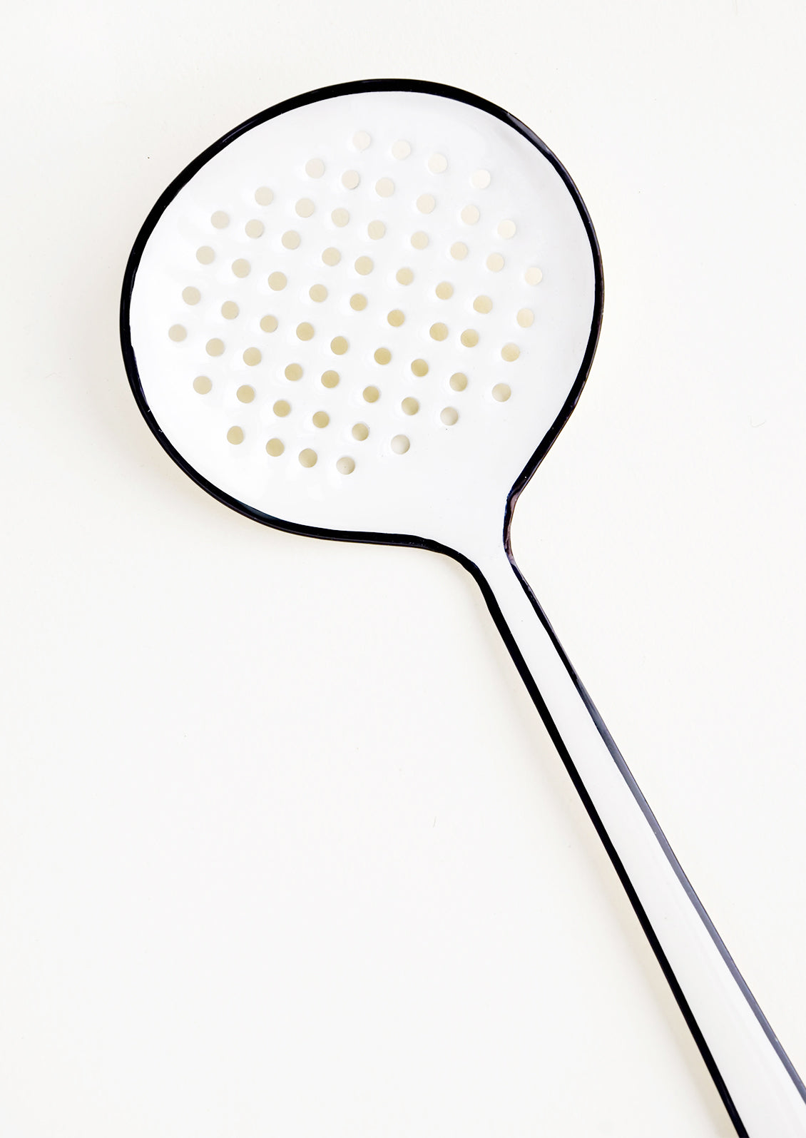 Enamel strainer utensil in white with painted black edging