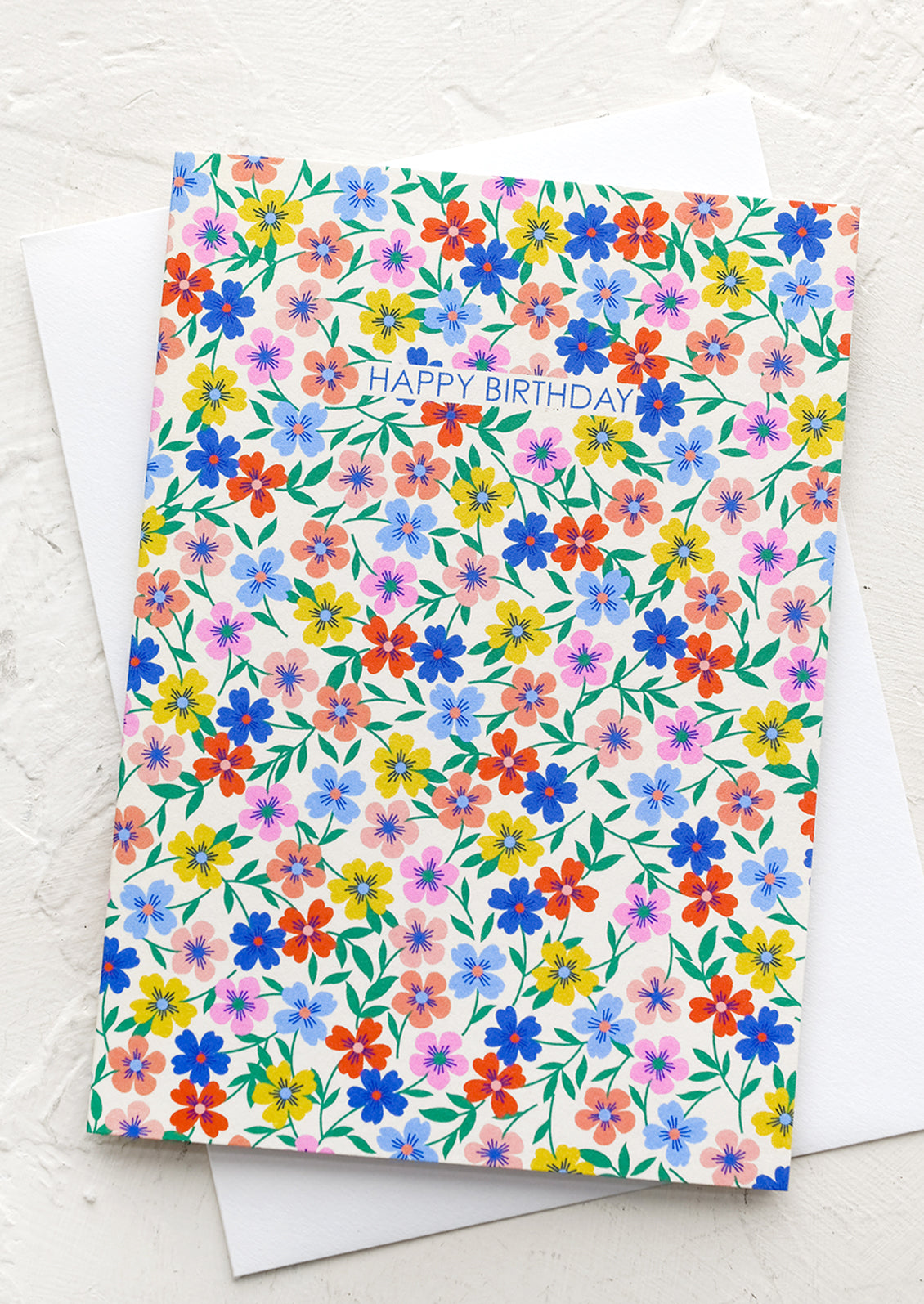 A card with overall digital floral pattern, text reads "happy birthday".