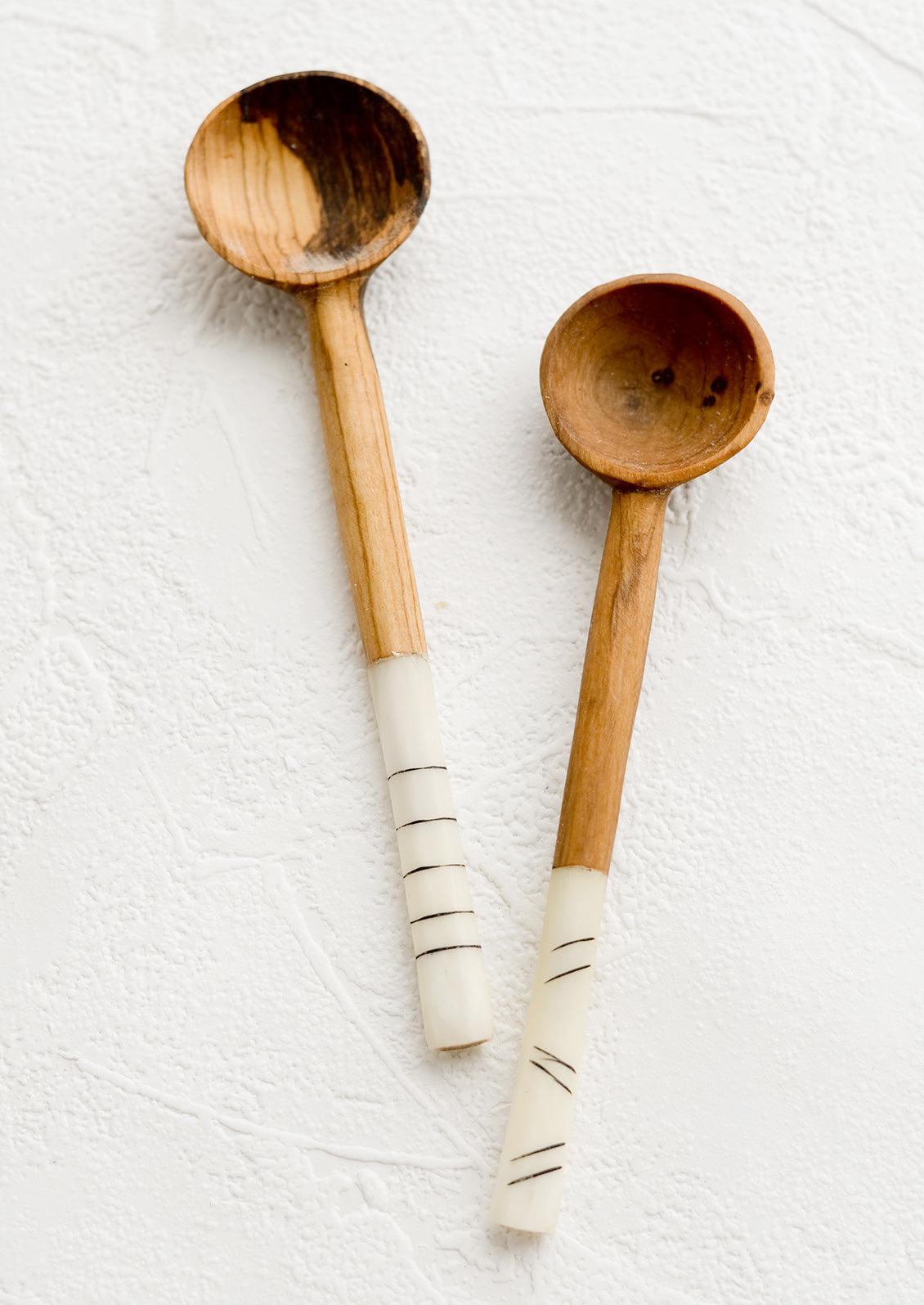 Olivewood coffee scoops with ivory and black etched bone detailing on handles.