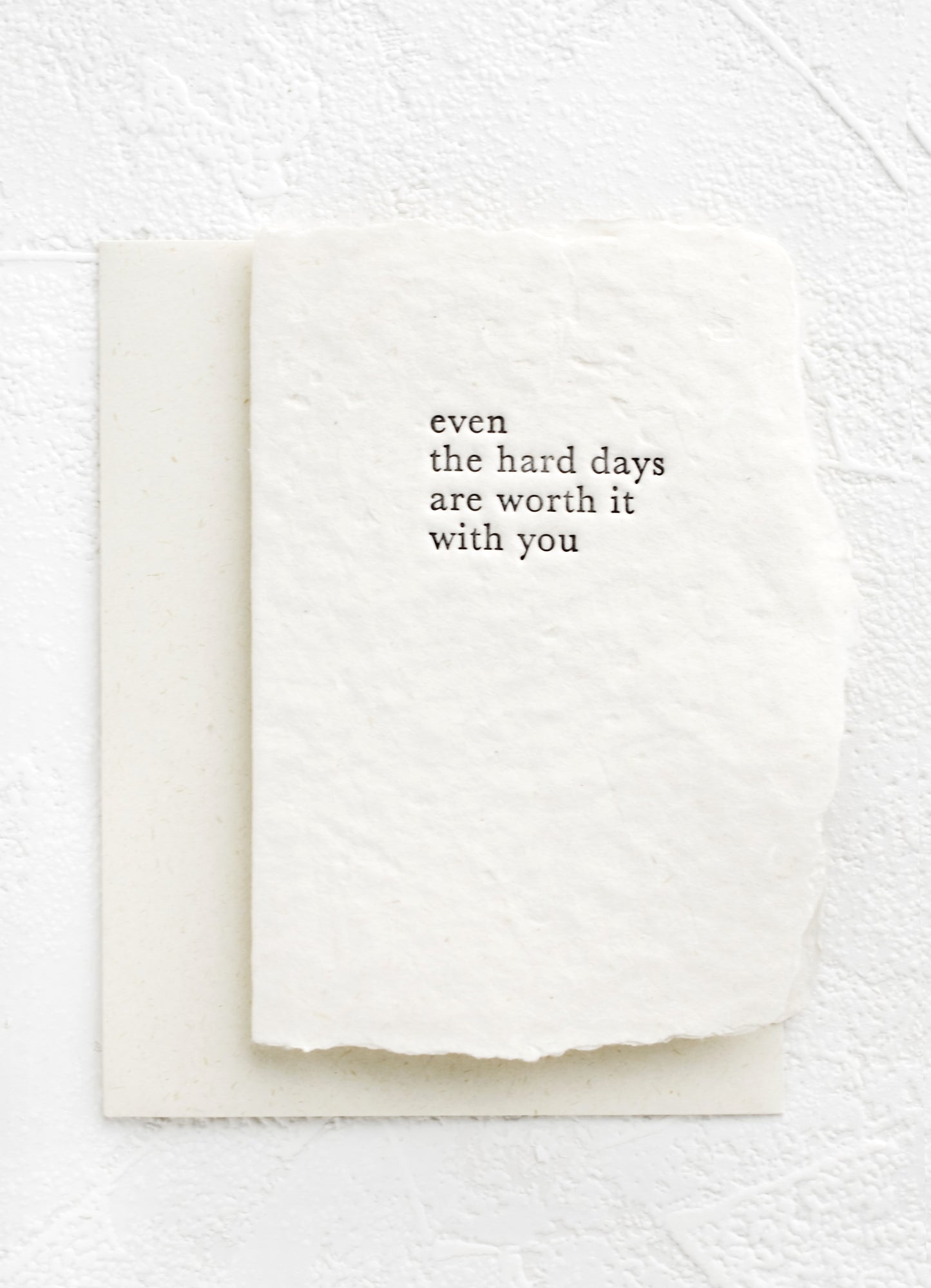 A greeting card made from handmade paper and text on front reads "Even the hard days are worth it with you".