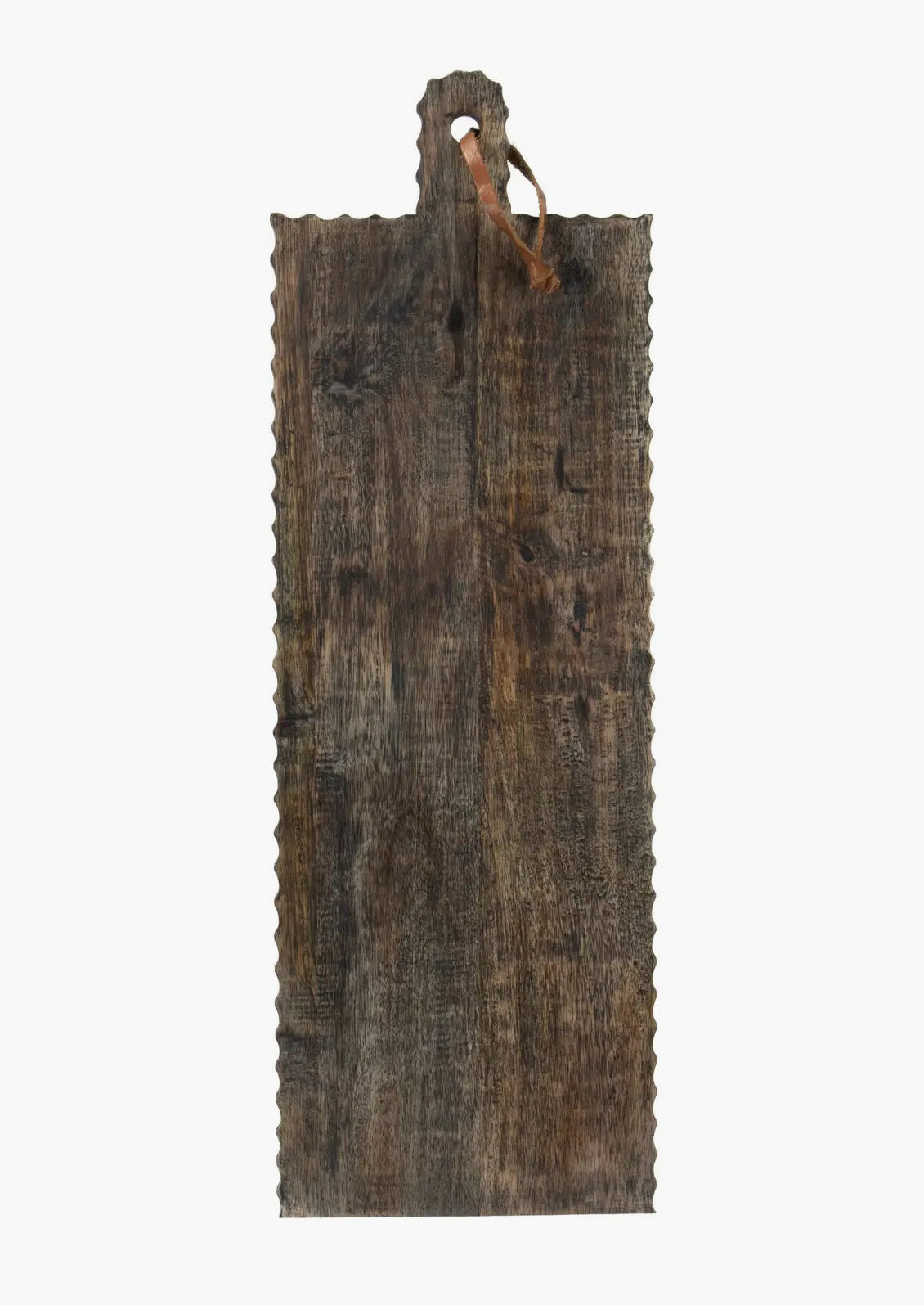 A rectangular, paddle-shaped cutting board with carved/fluted edges and leather tie.