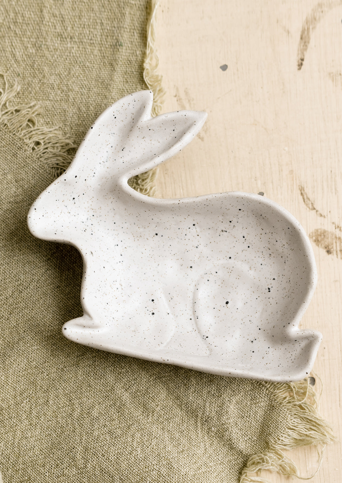 A rabbit shaped trinket dish in white.