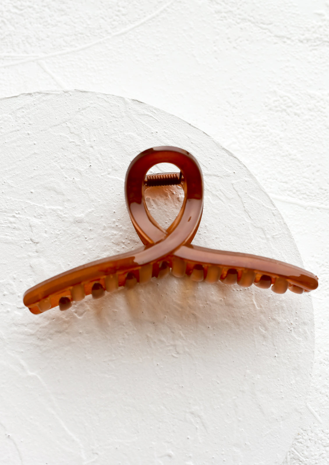 A french twist acrylic hair clip in amber.