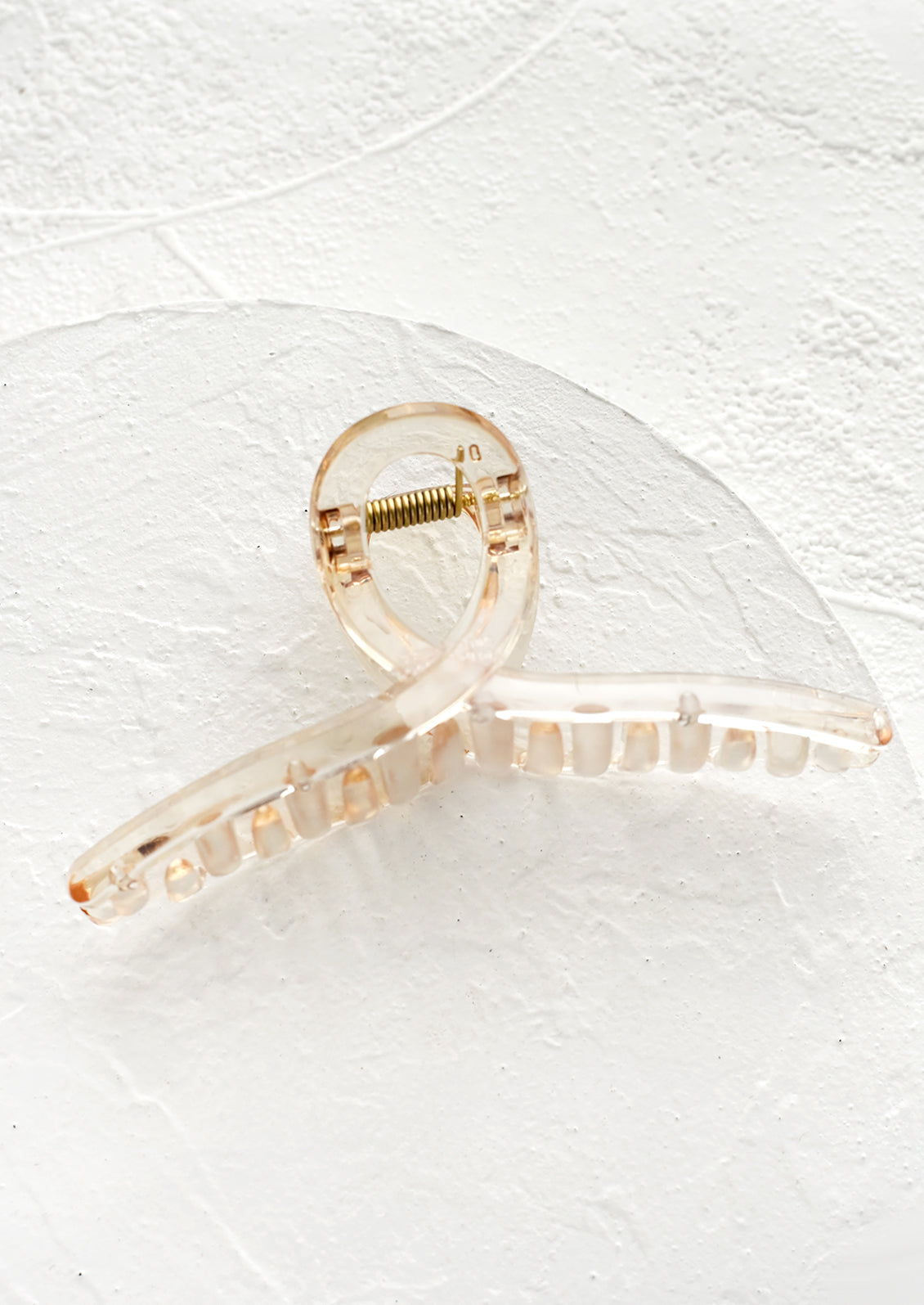 A french twist acrylic hair clip in pale honey.