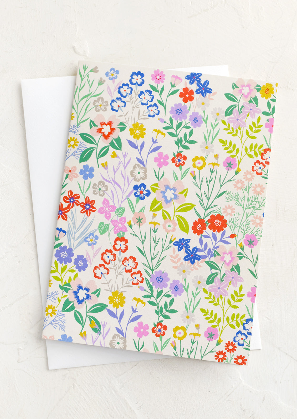 A greeting card with colorful floral pattern.