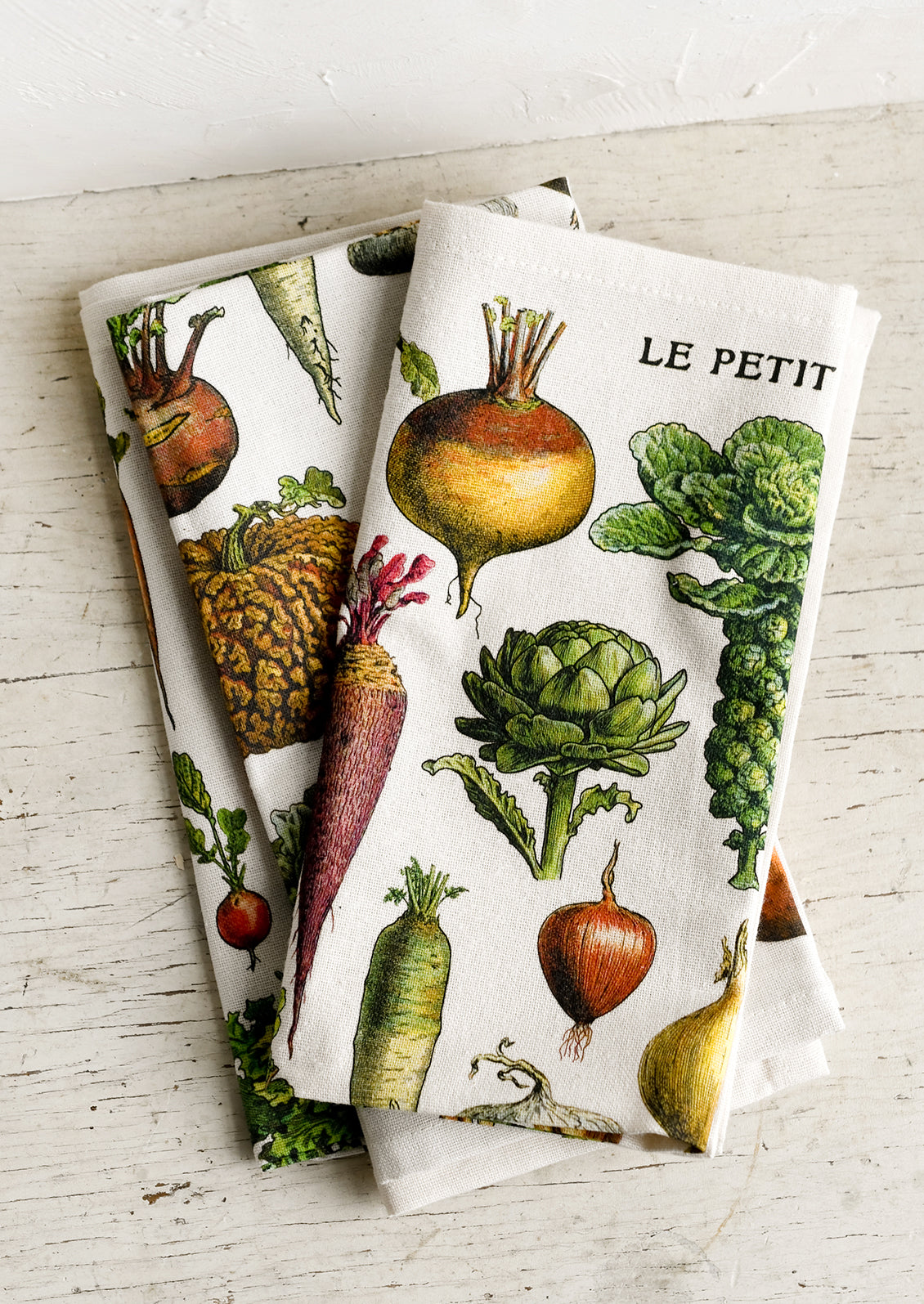 A set of vegetable print napkins.