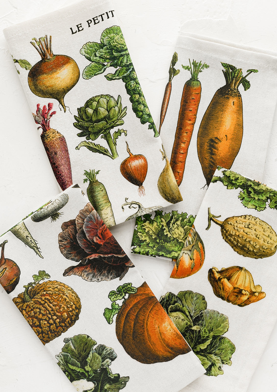 A set of vegetable print napkins.