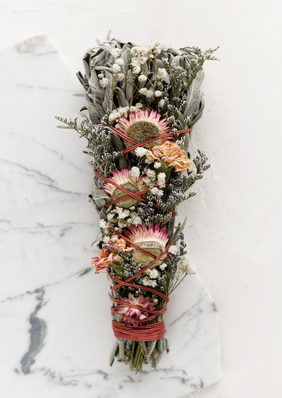 An extra large smudge bundle with sage and flowers.