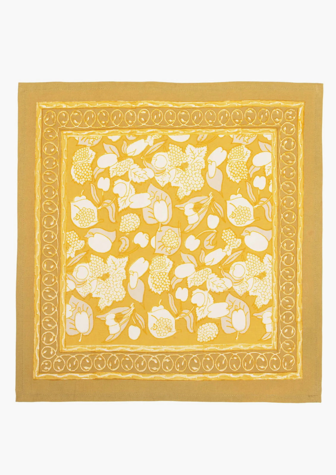 A pair of mustard/gold napkins with fruit print.