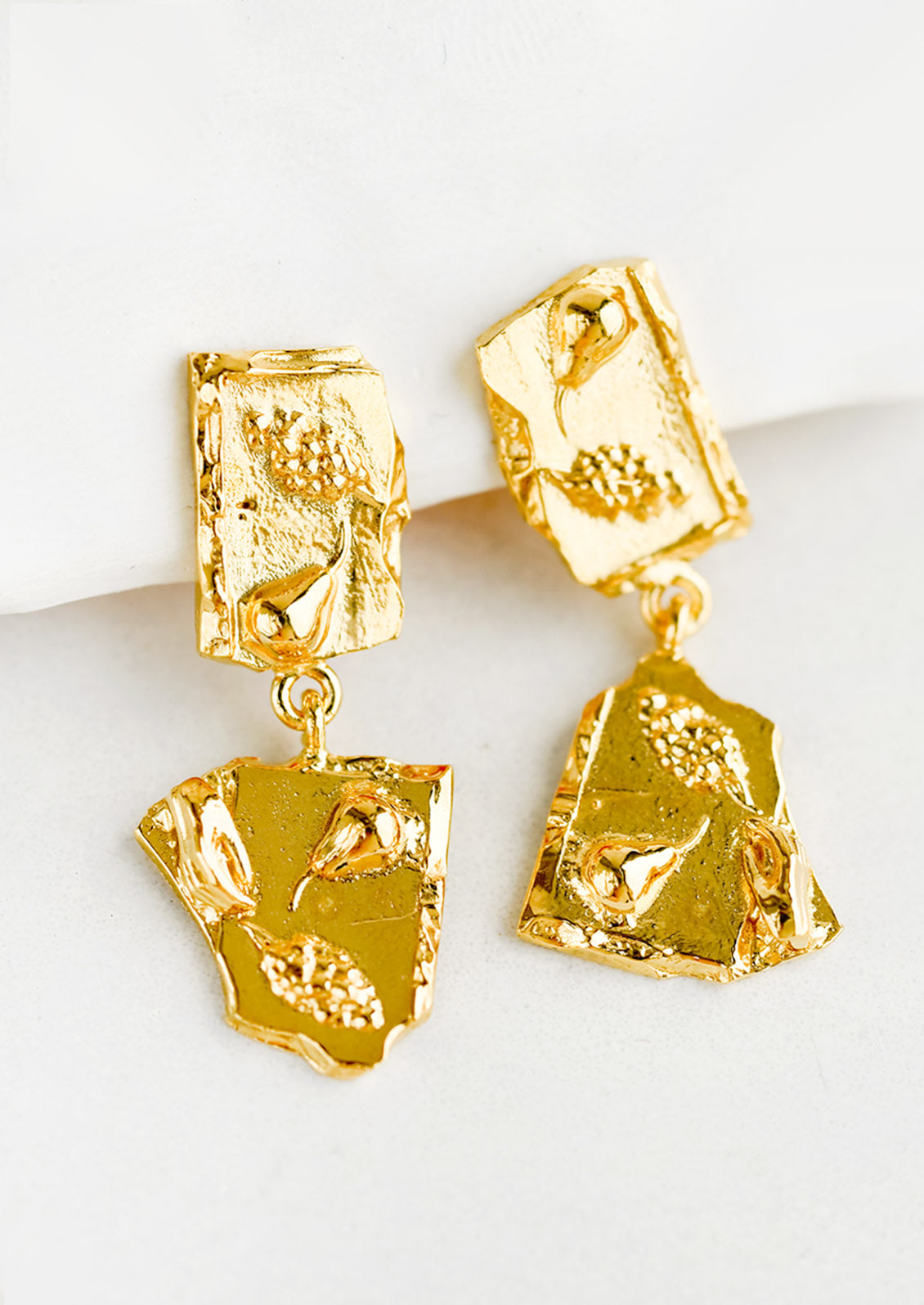 A pair of earrings with double broken tile silhouette.