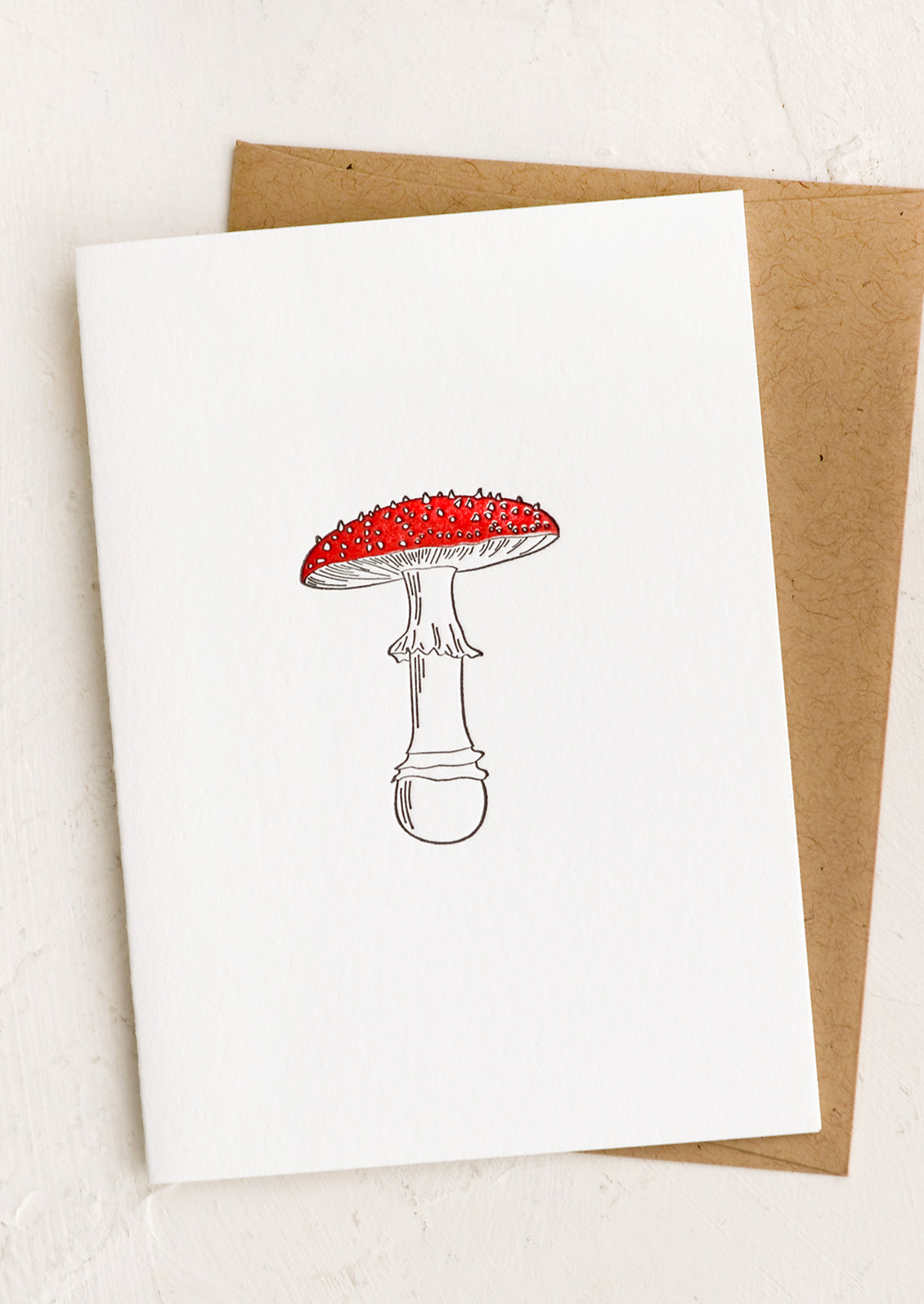 A blank white card with agaric mushroom illustration.