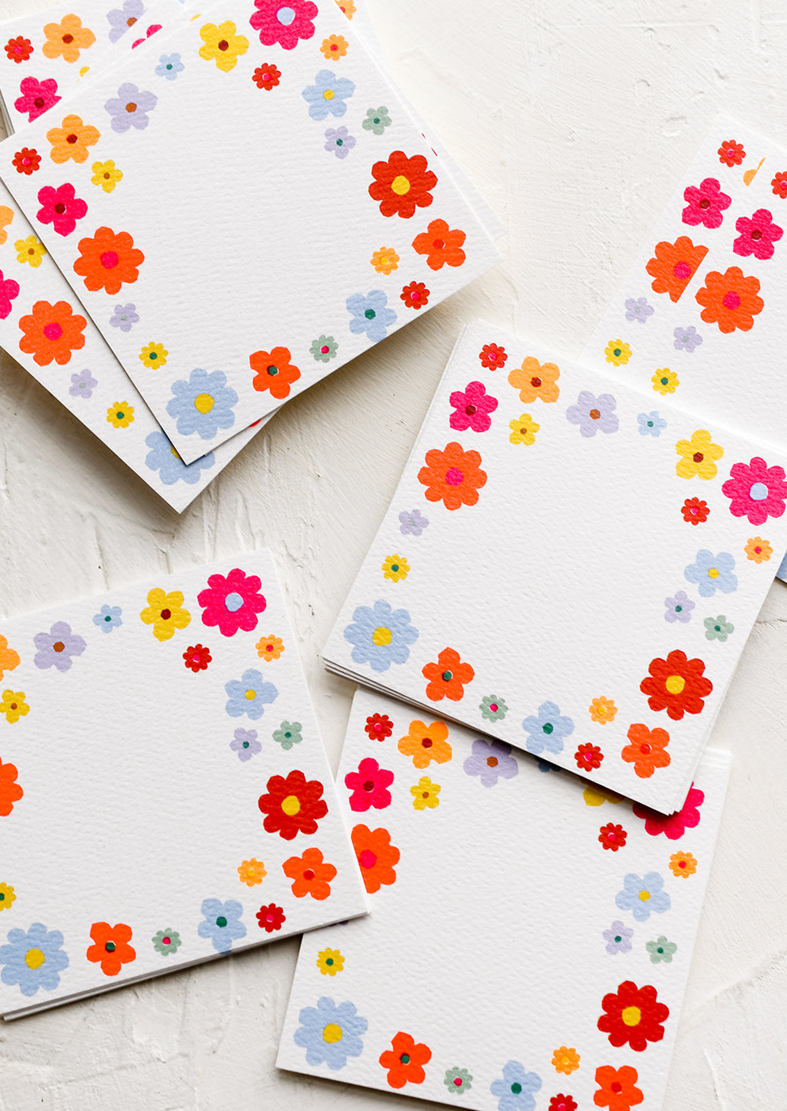 Mini square notecards with floral border.