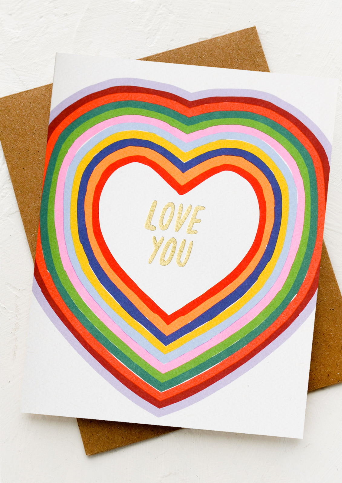 A colorful heart with gold letting at center reading "Love you".