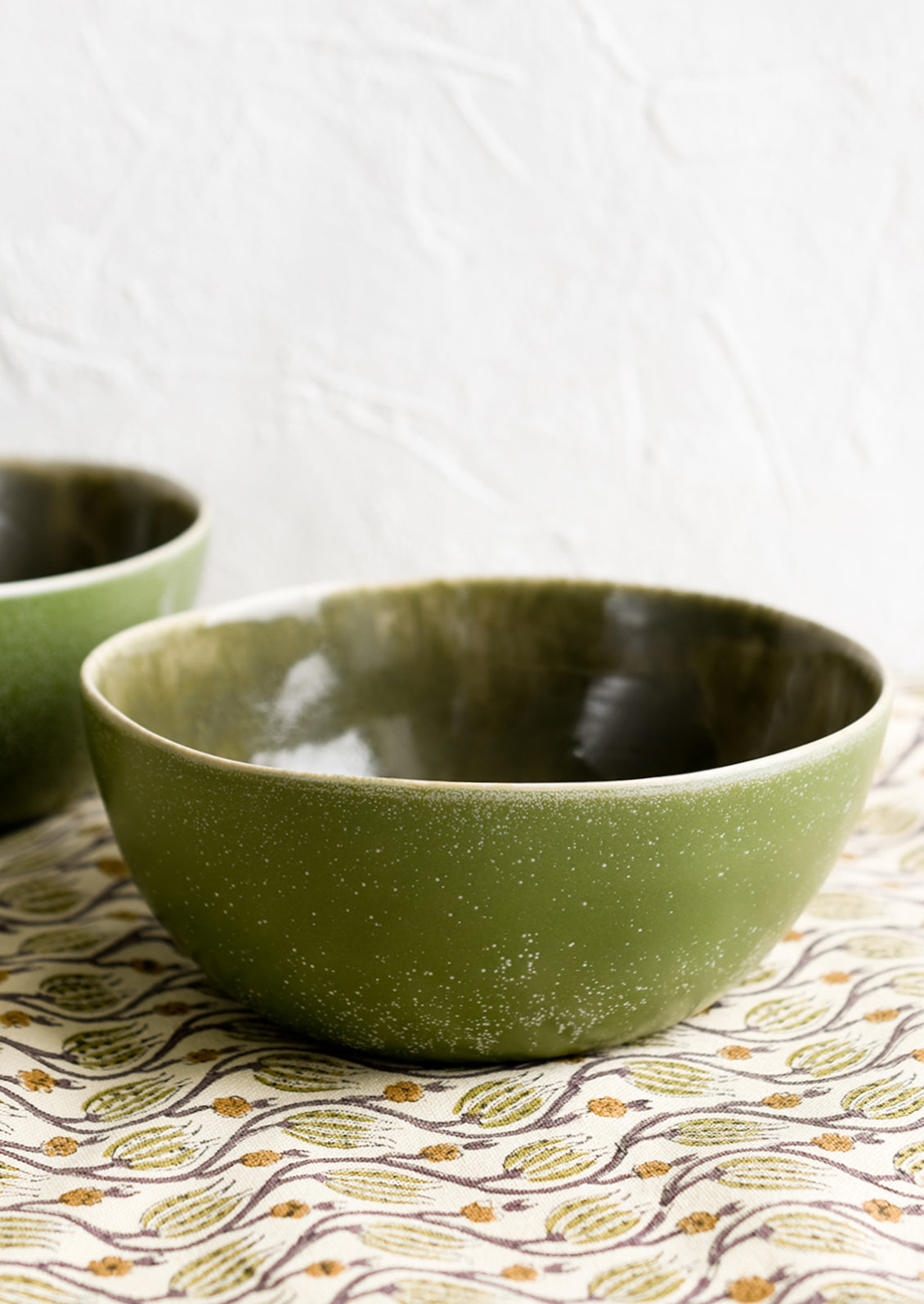 An olive green ceramic bowl.