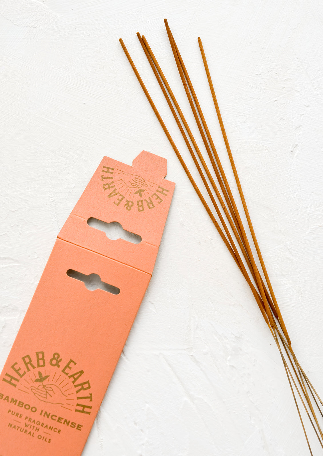 Long, skinny sticks of dipped incense on bamboo sticks.