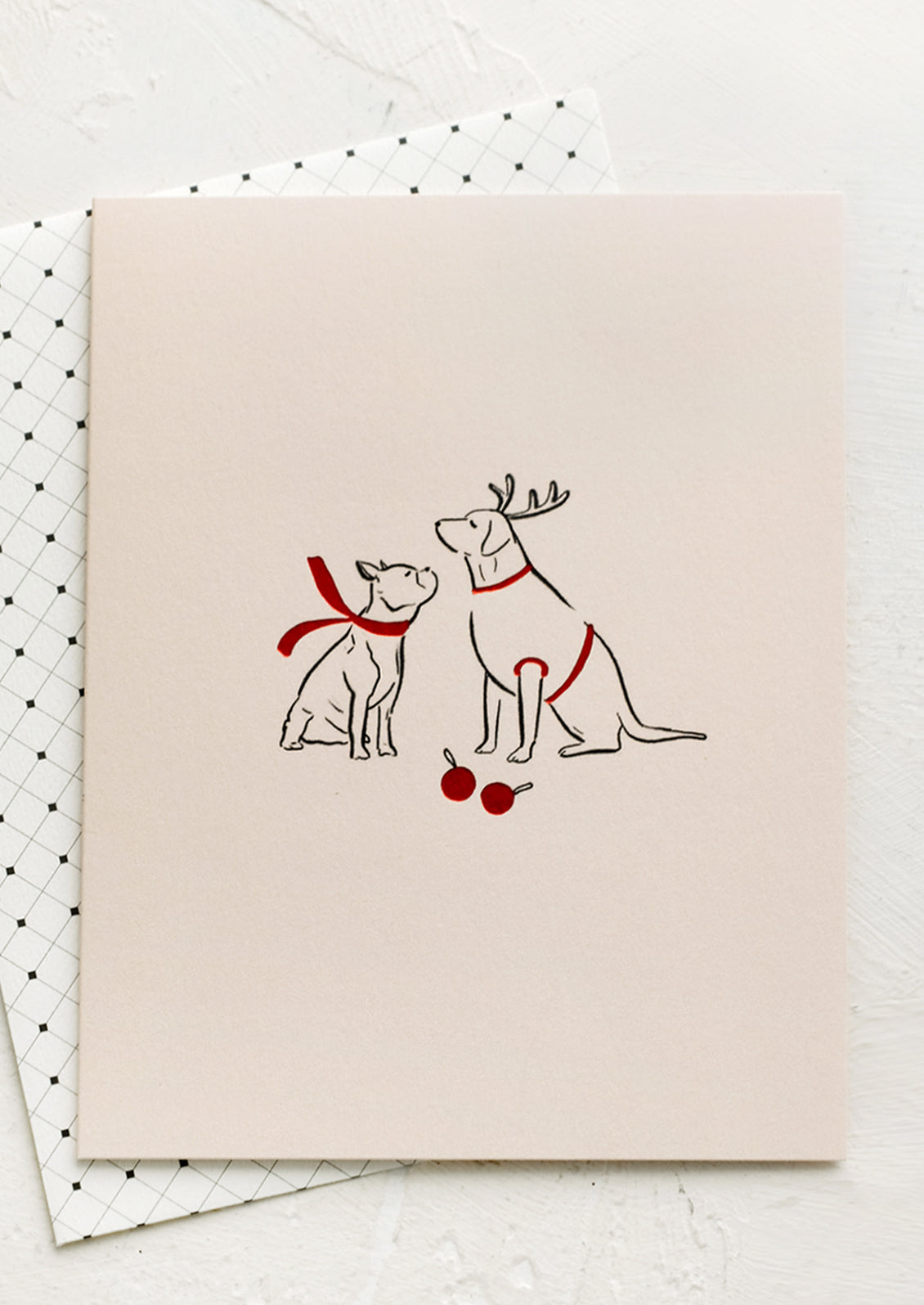 A card with illustration of two dogs wearing red scarves.