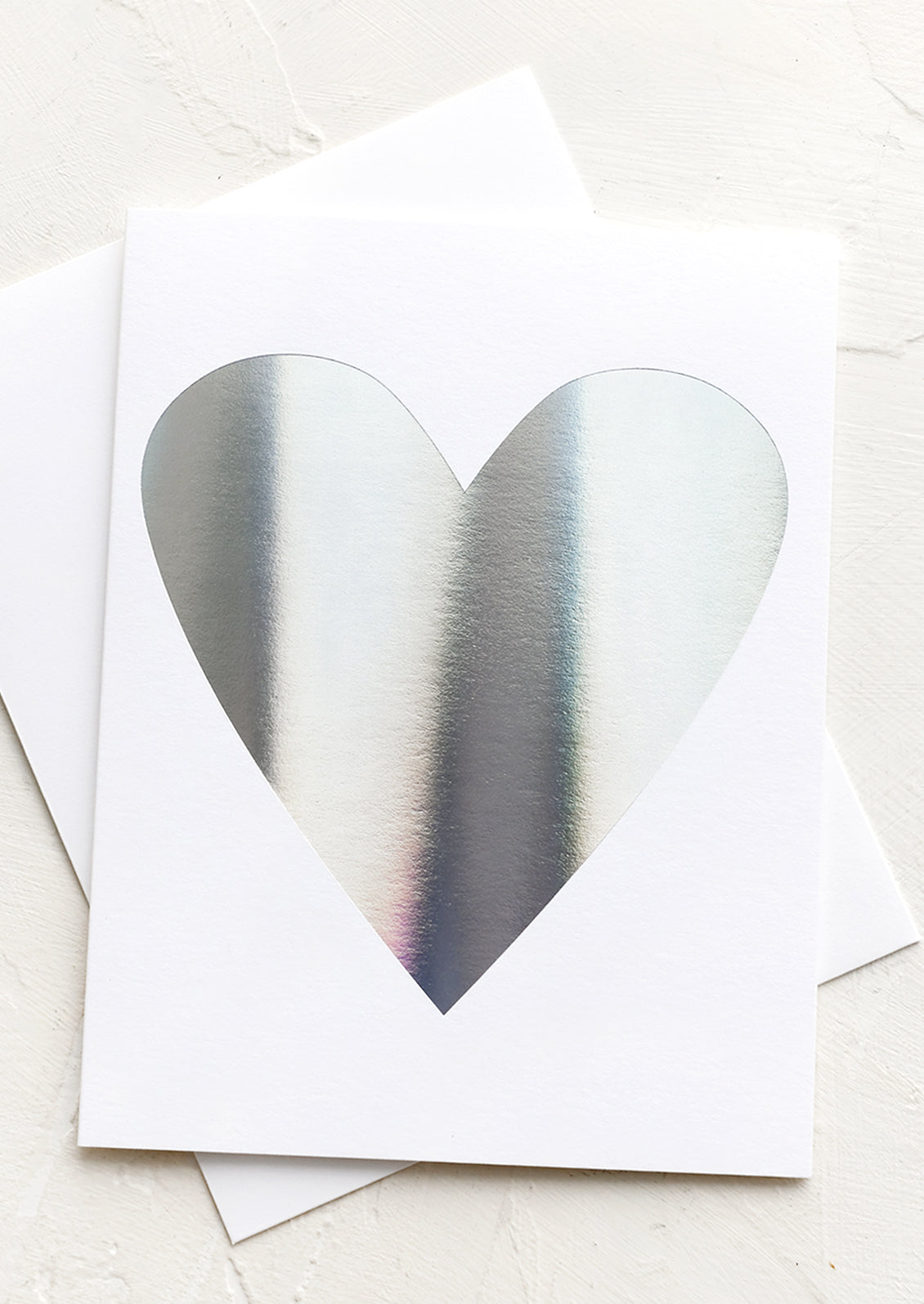 White card with silver holographic heart.