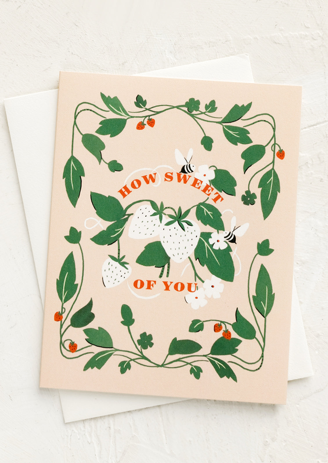 A greeting card with image of bees and strawberries and text reading "How sweet of you".