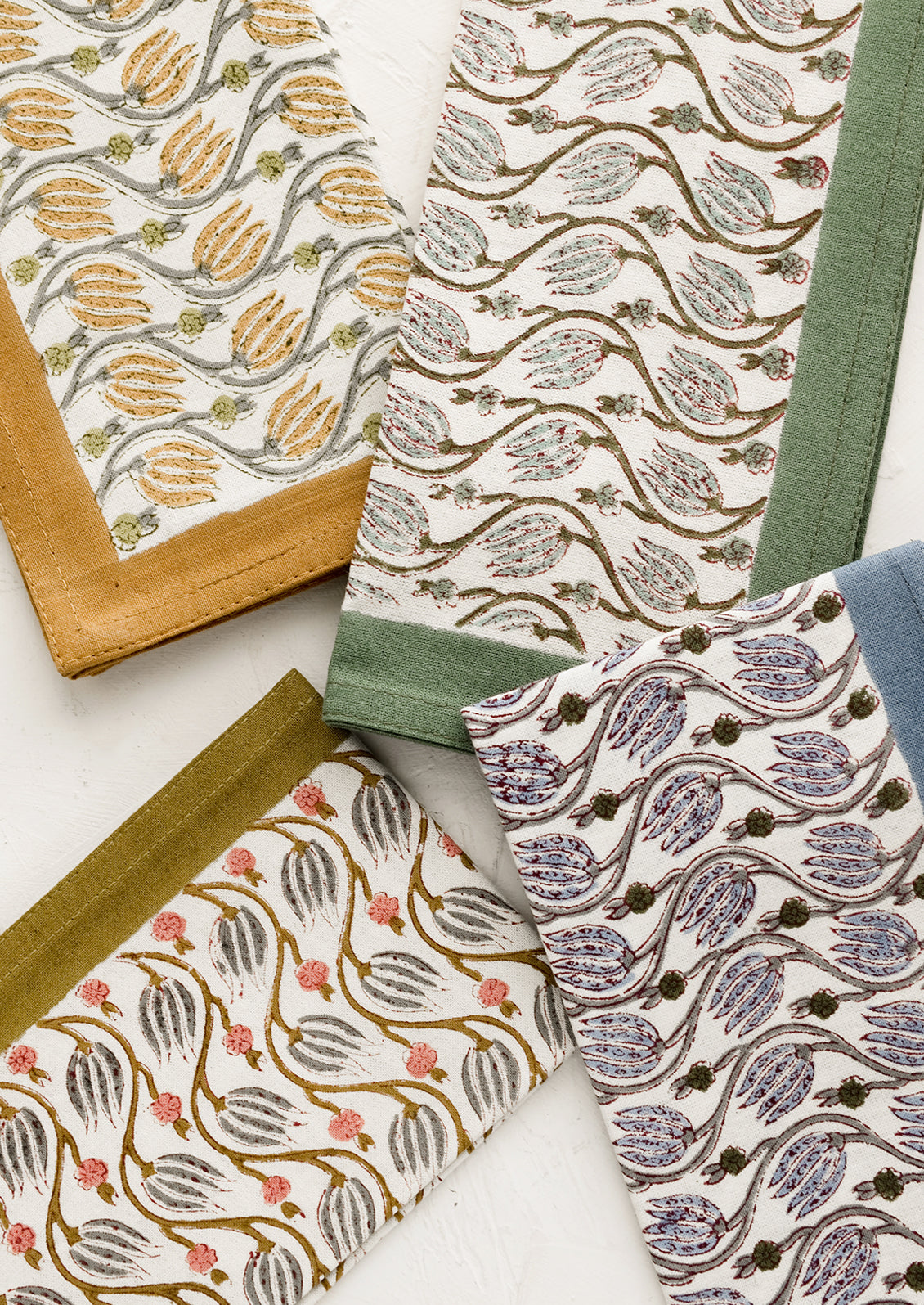 Floral print napkins in assortment of colors.