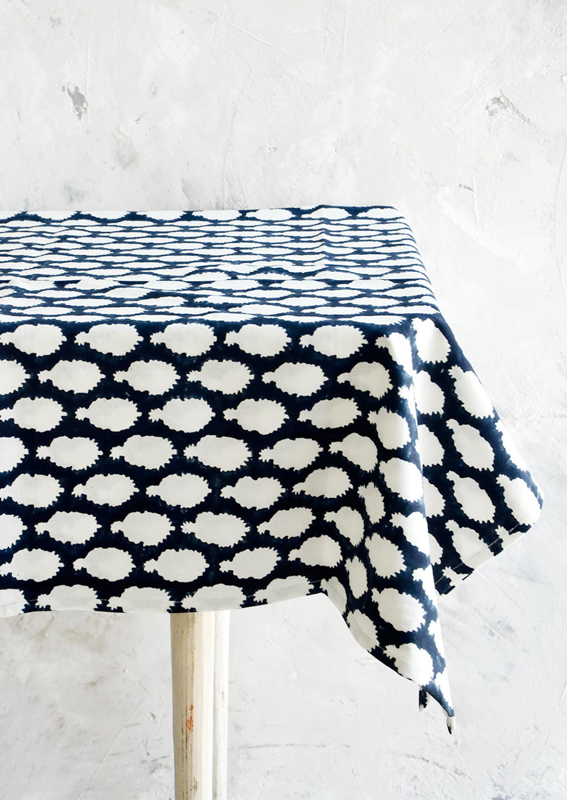 Indigo cotton tablecloth with block printed batik print, displayed on table