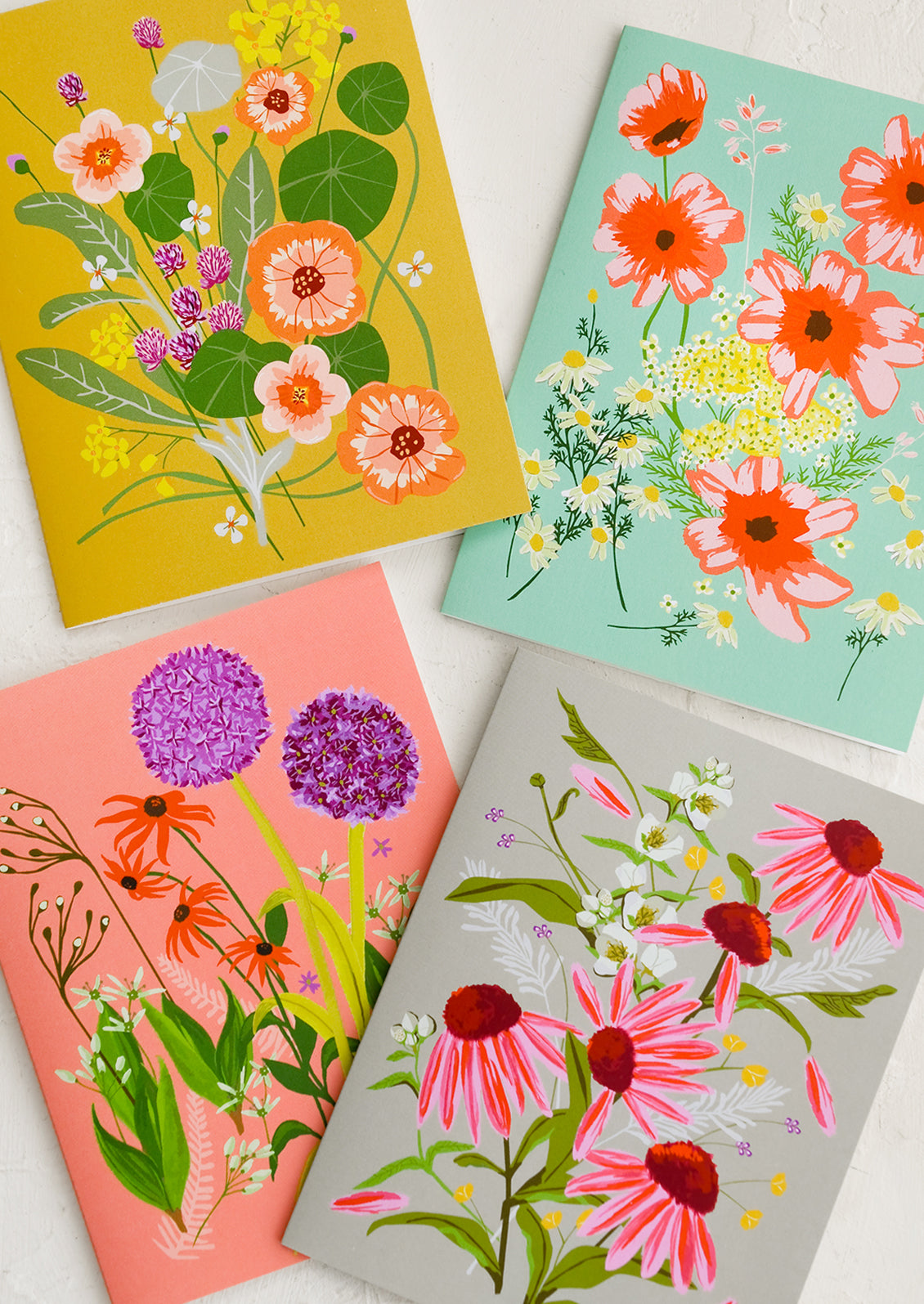 A set of four assorted floral print cards.