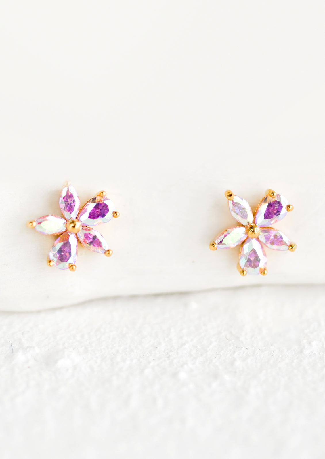 Small iridescent flower stud earrings.