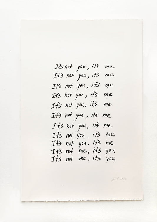 Art print featuring repeated rows of handwritten text, starting with "It's not you, it's me" and ending with "It's not me, it's you"