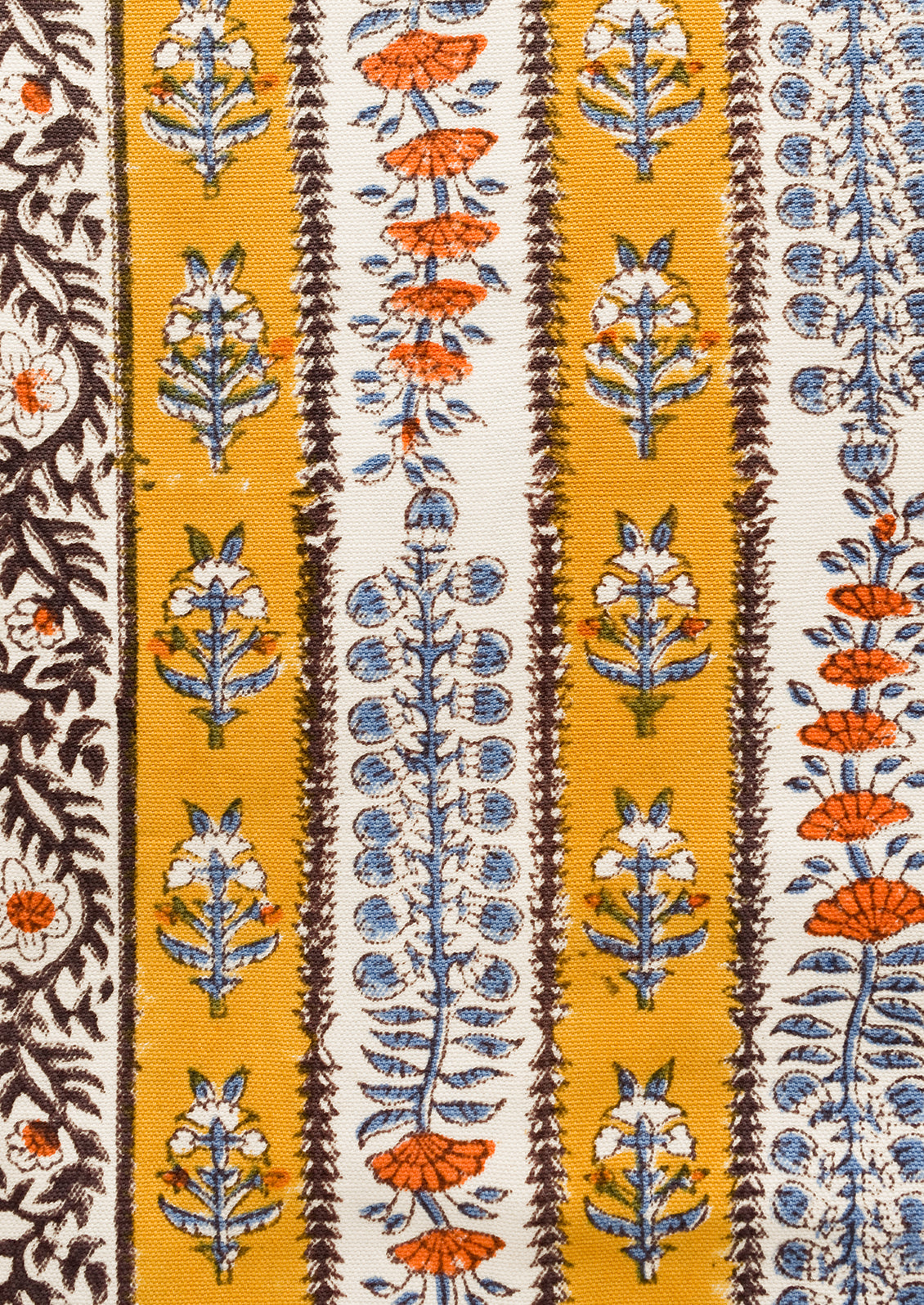 A stripe floral print table runner in marigold, purple and blue.
