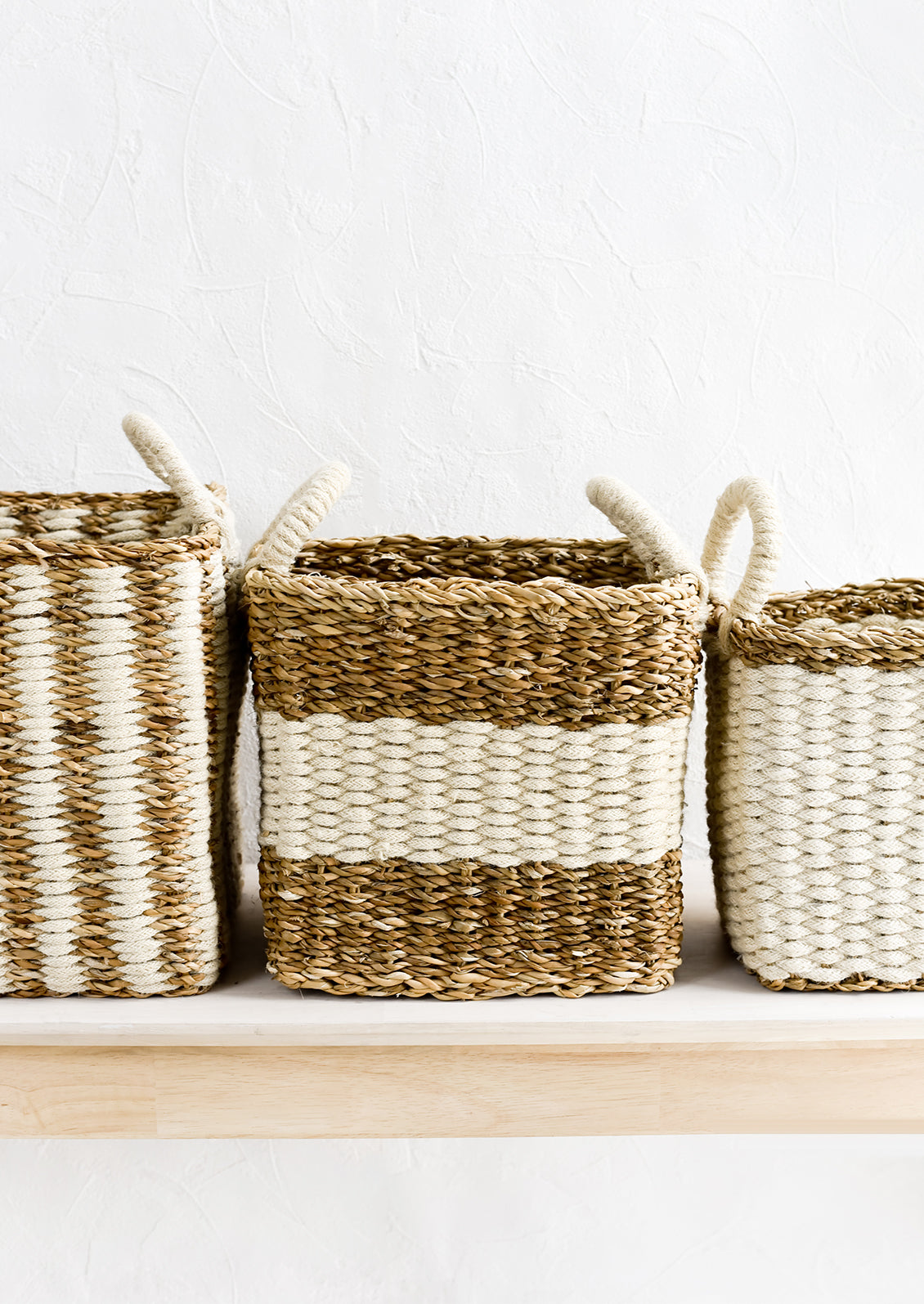 Jute and straw storage baskets in incremental sizes.