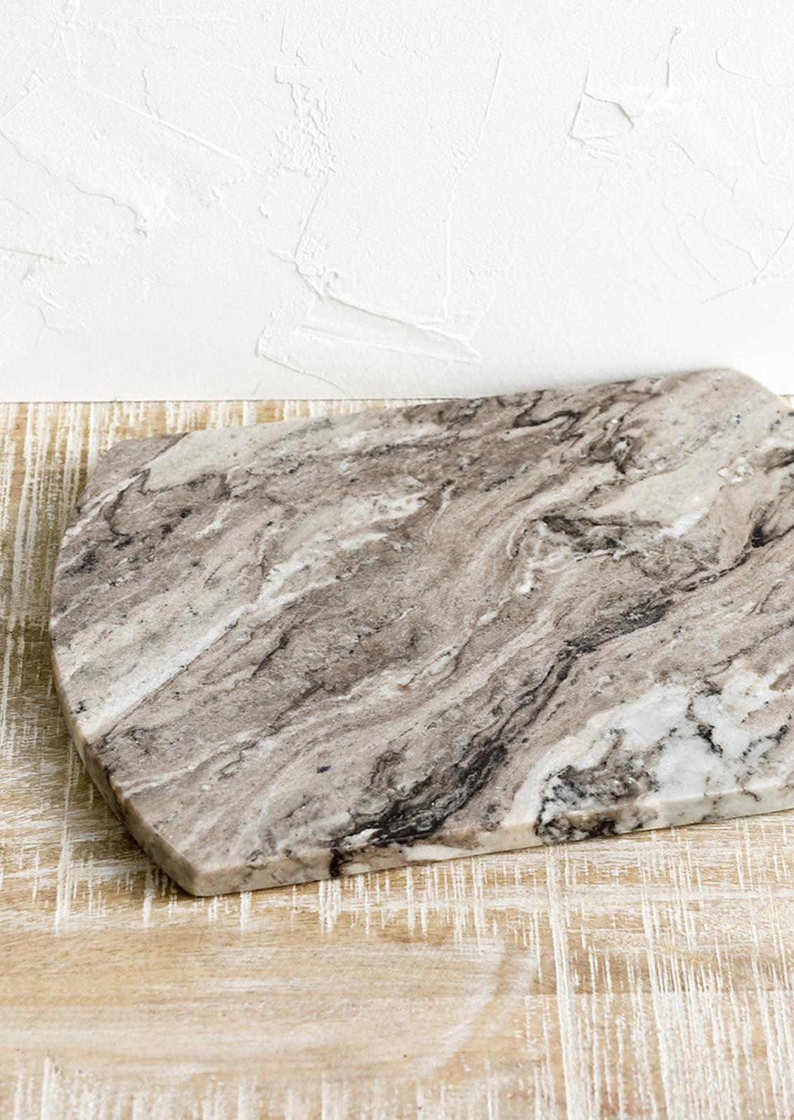 a rectangular marble serving board with rounded sides