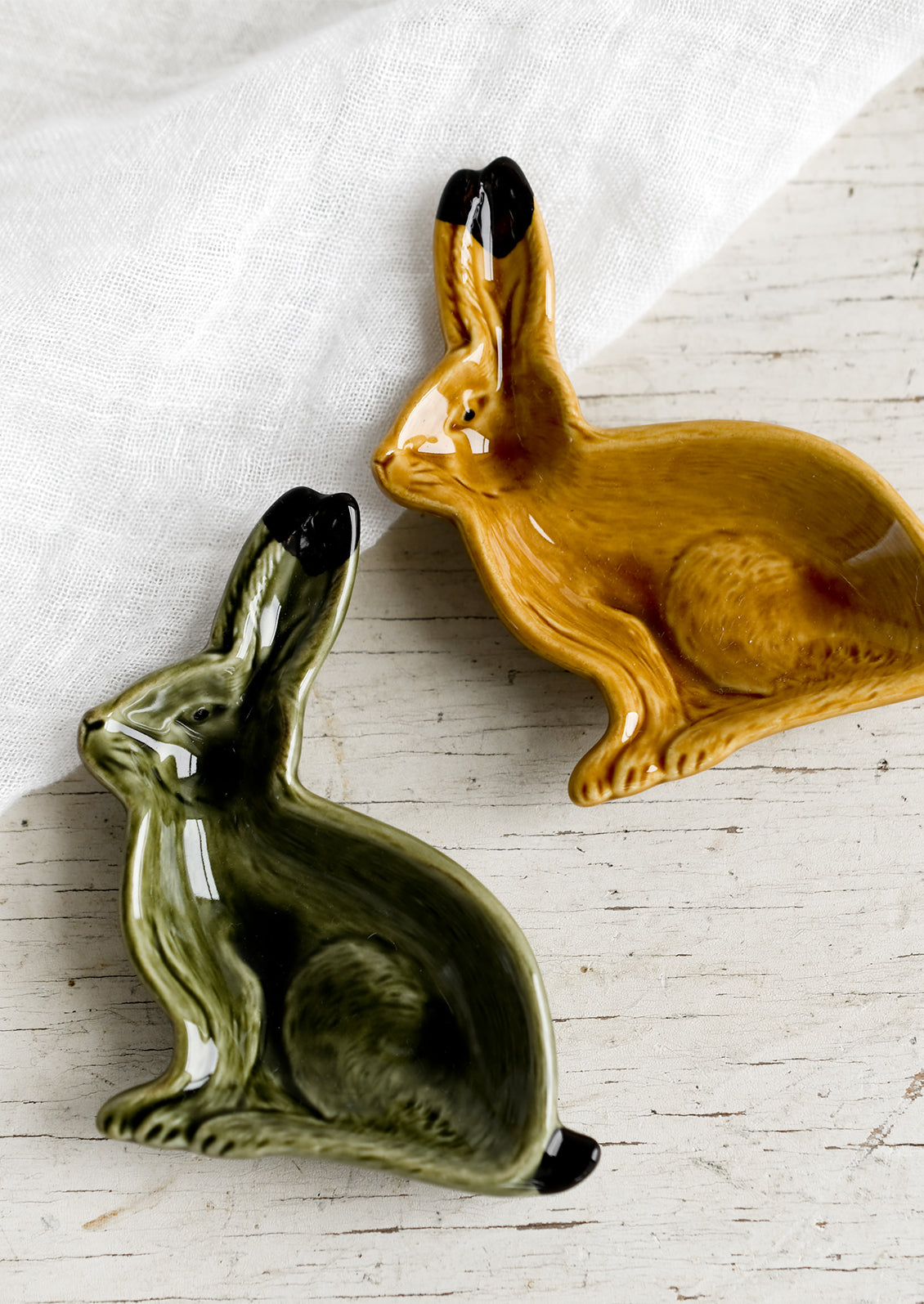 Rabbit shaped trinket dishes in green and brown.