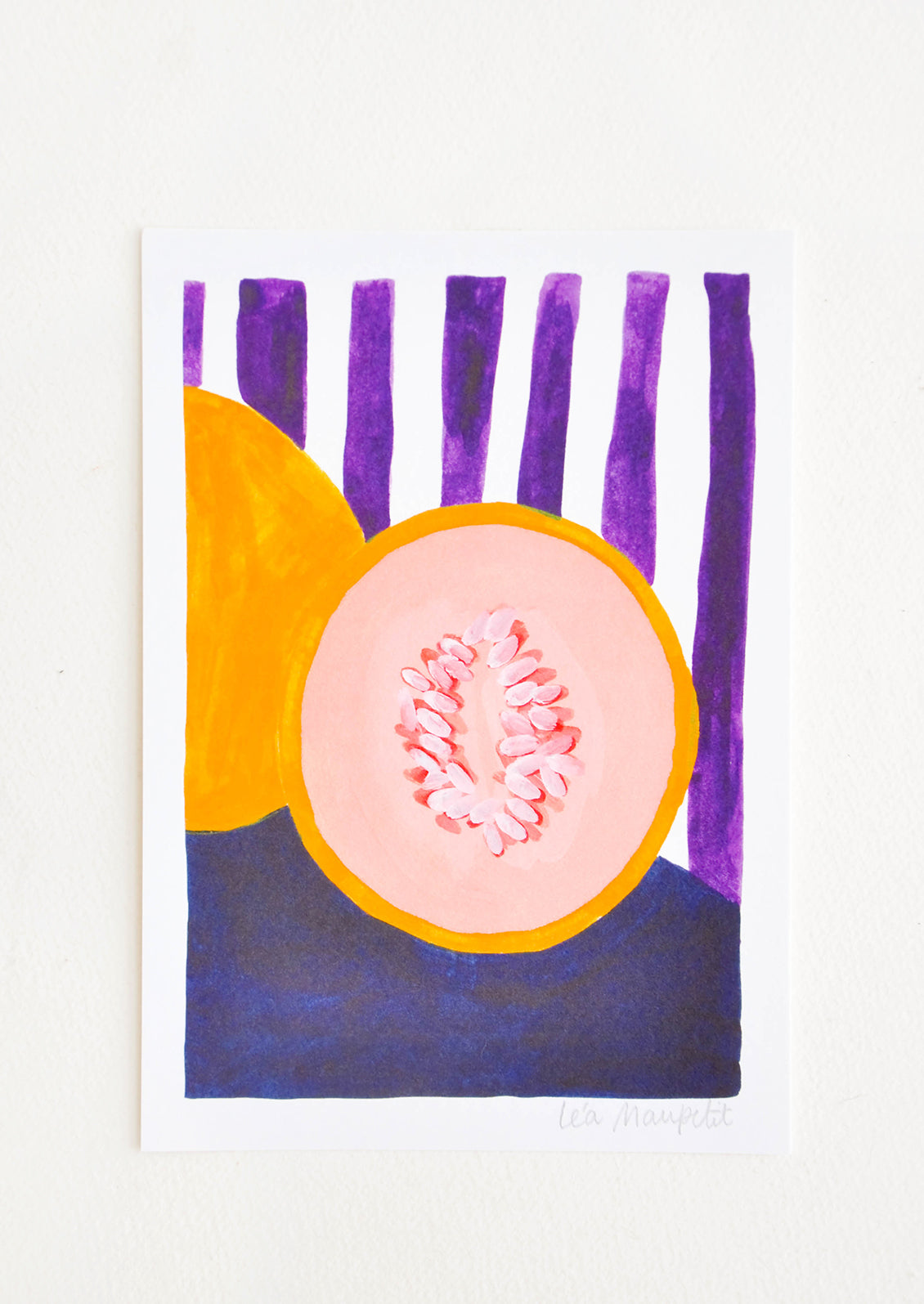 Still life of a cut cantaloup against a backdrop of purple and white vertical stripes.