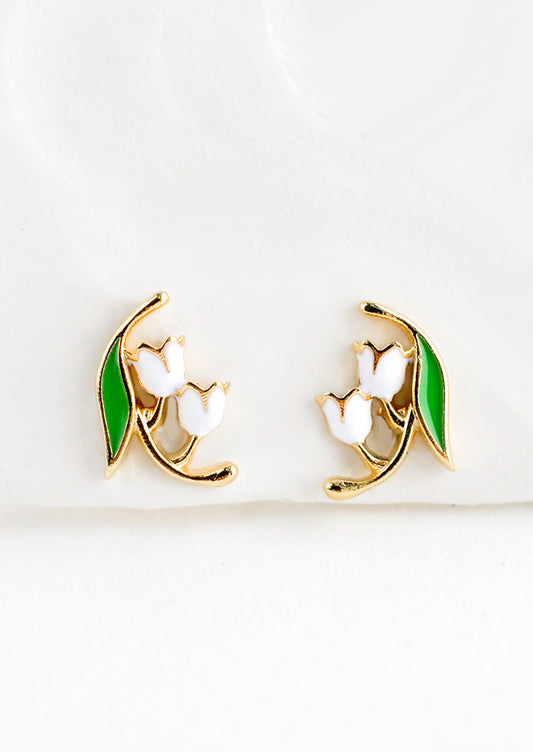 Small gold stud earrings in the shape of a lily of the valley flower, constructed in green and white enamel finish.