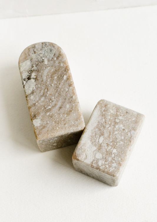 A pair of marble arch-shaped bookends in short and tall heights.