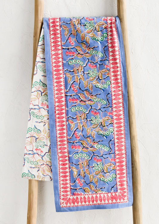 A block printed table runner in blue and pink floral.