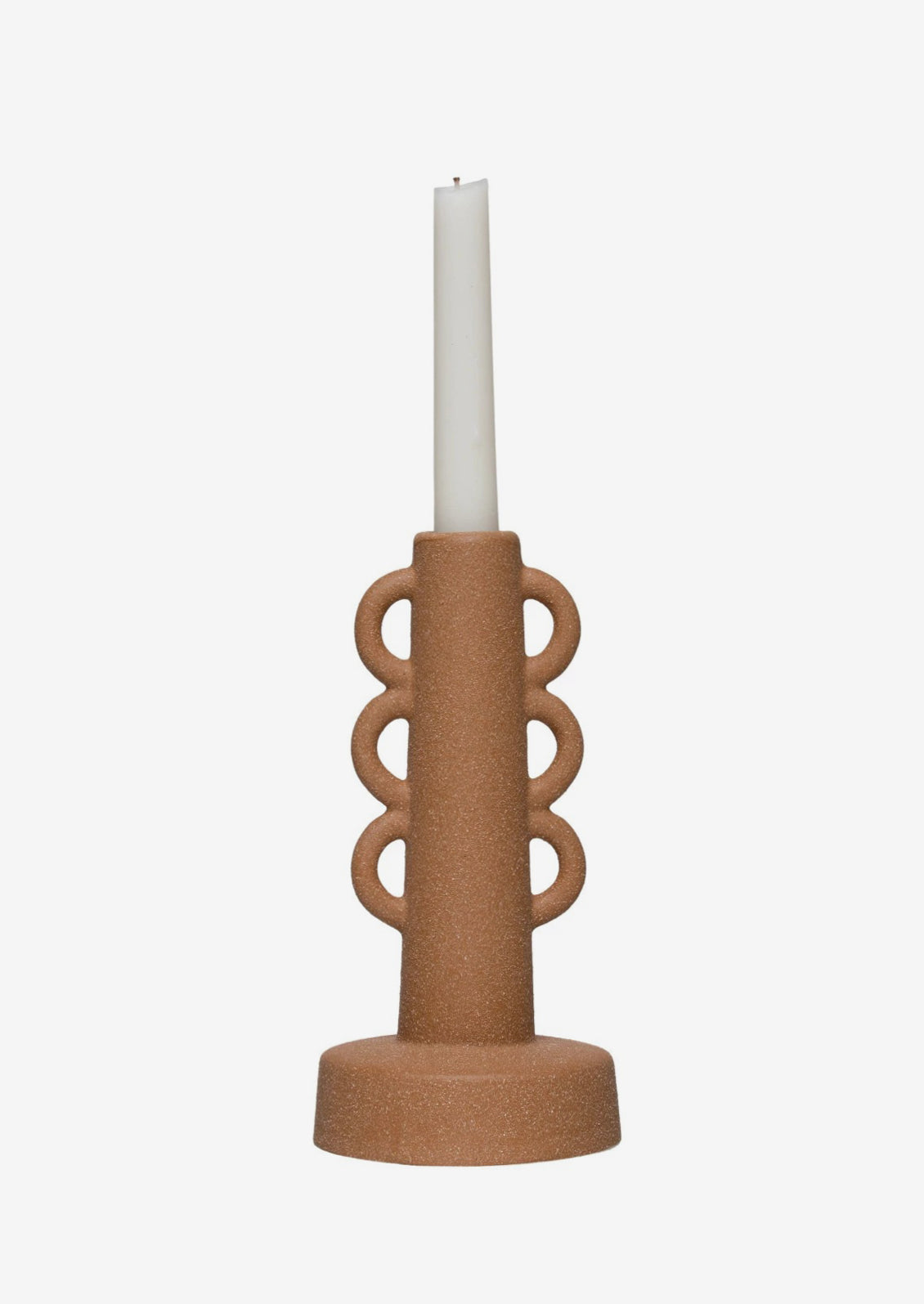 A textured sand colored taper holder with decorative loop shape.