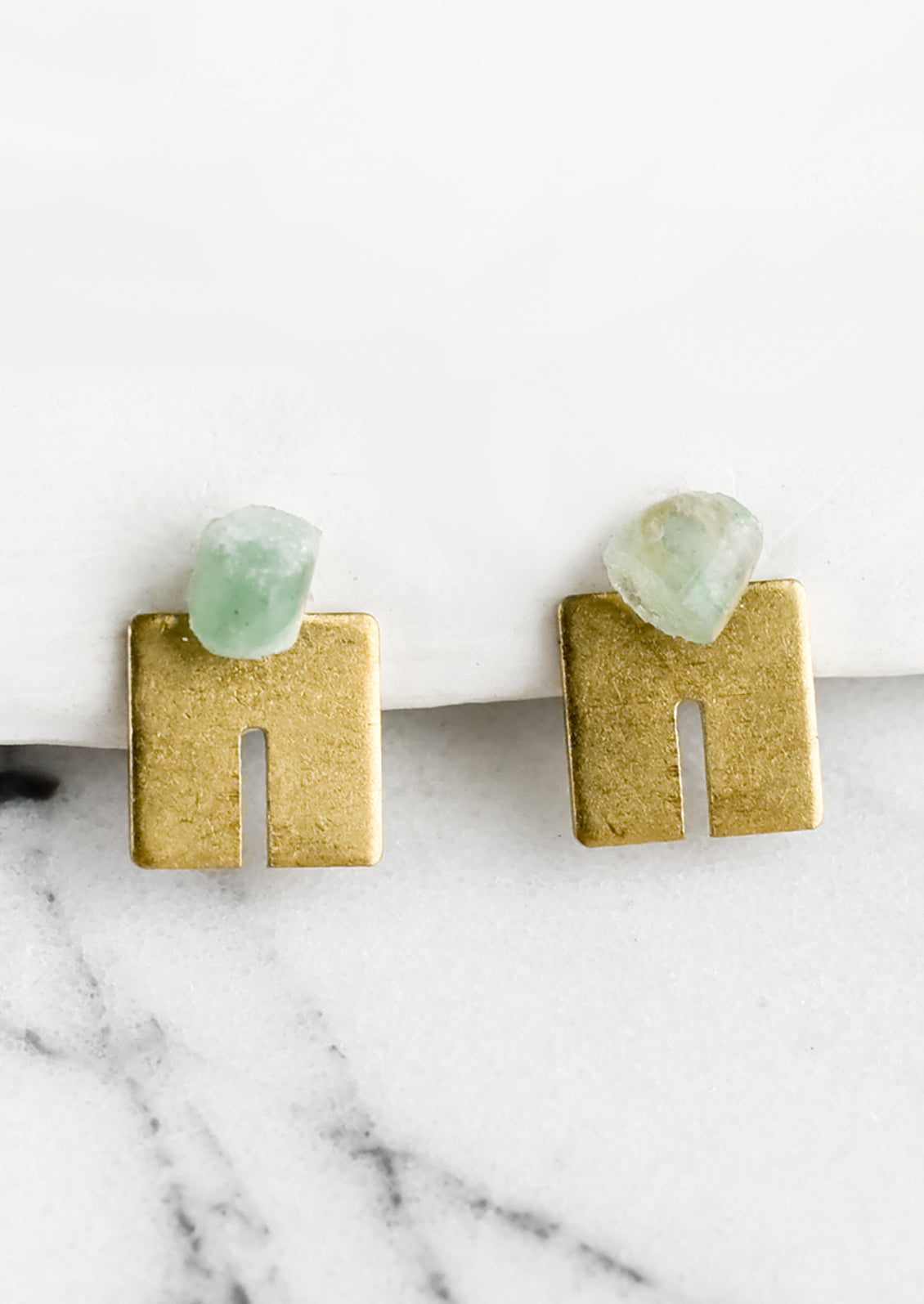 A pair of squared U shaped brass studs with raw aventurine gemstone post.