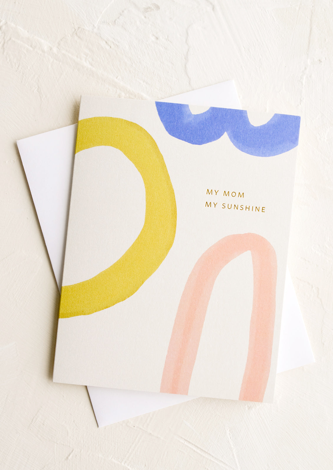A mother's day greeting card with abstract text and "my mom, my sunshine" in small lettering.