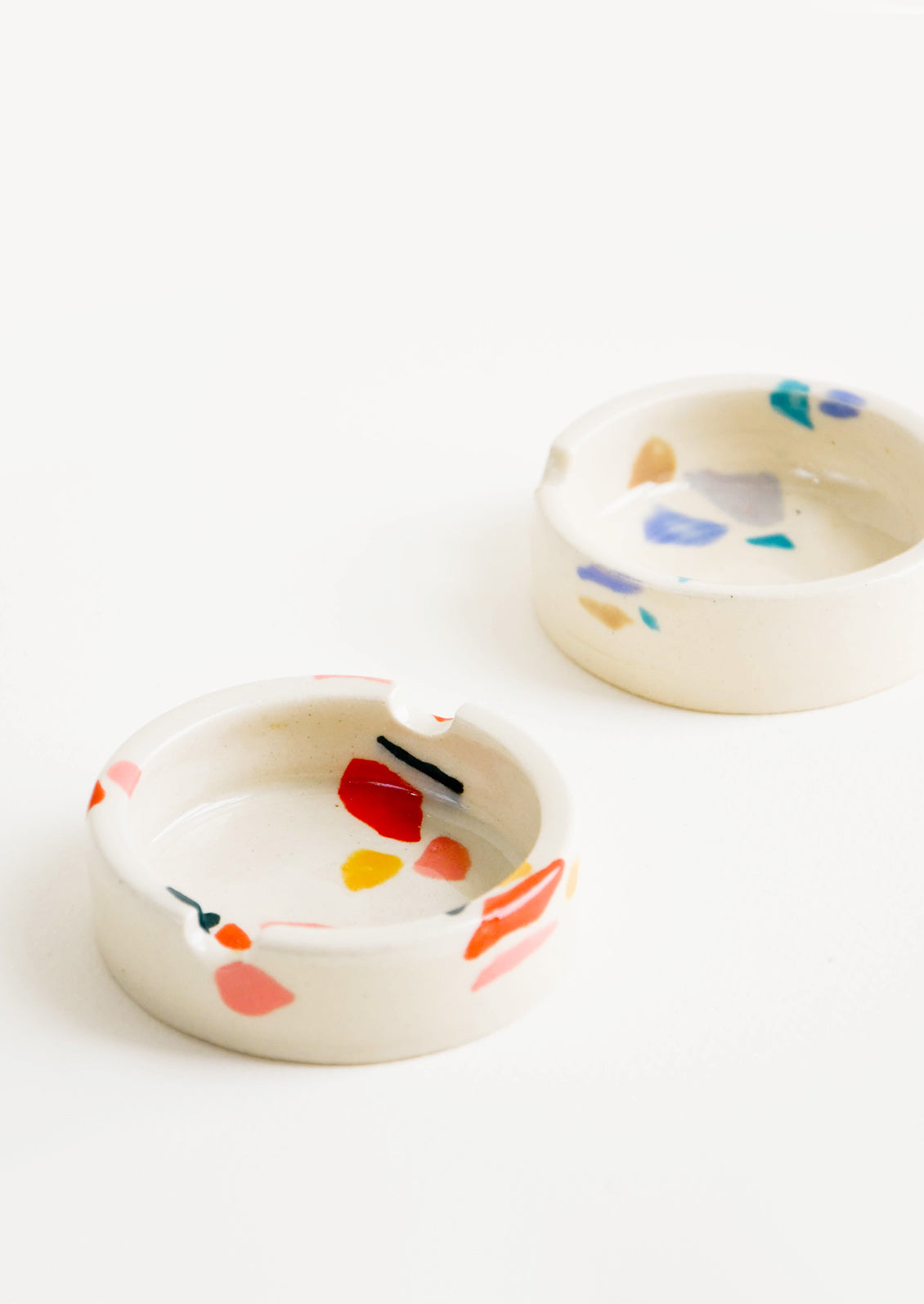 Ceramic ashtray with allover hand painted terrazzo pattern in a variety of colors