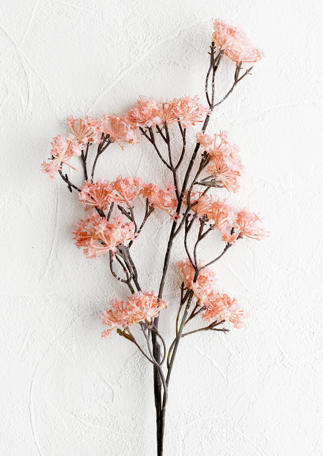 A faux cherry blossom spray.