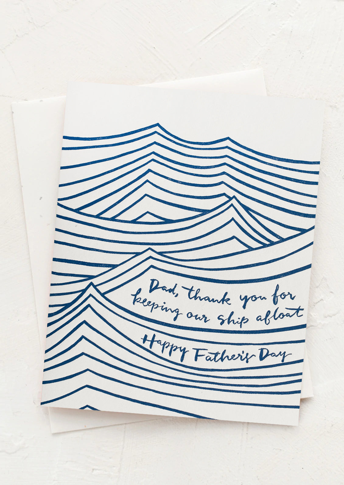 A wave printed card reading "Dad, thank you for keeping our ship afloat. Happy Father's Day".