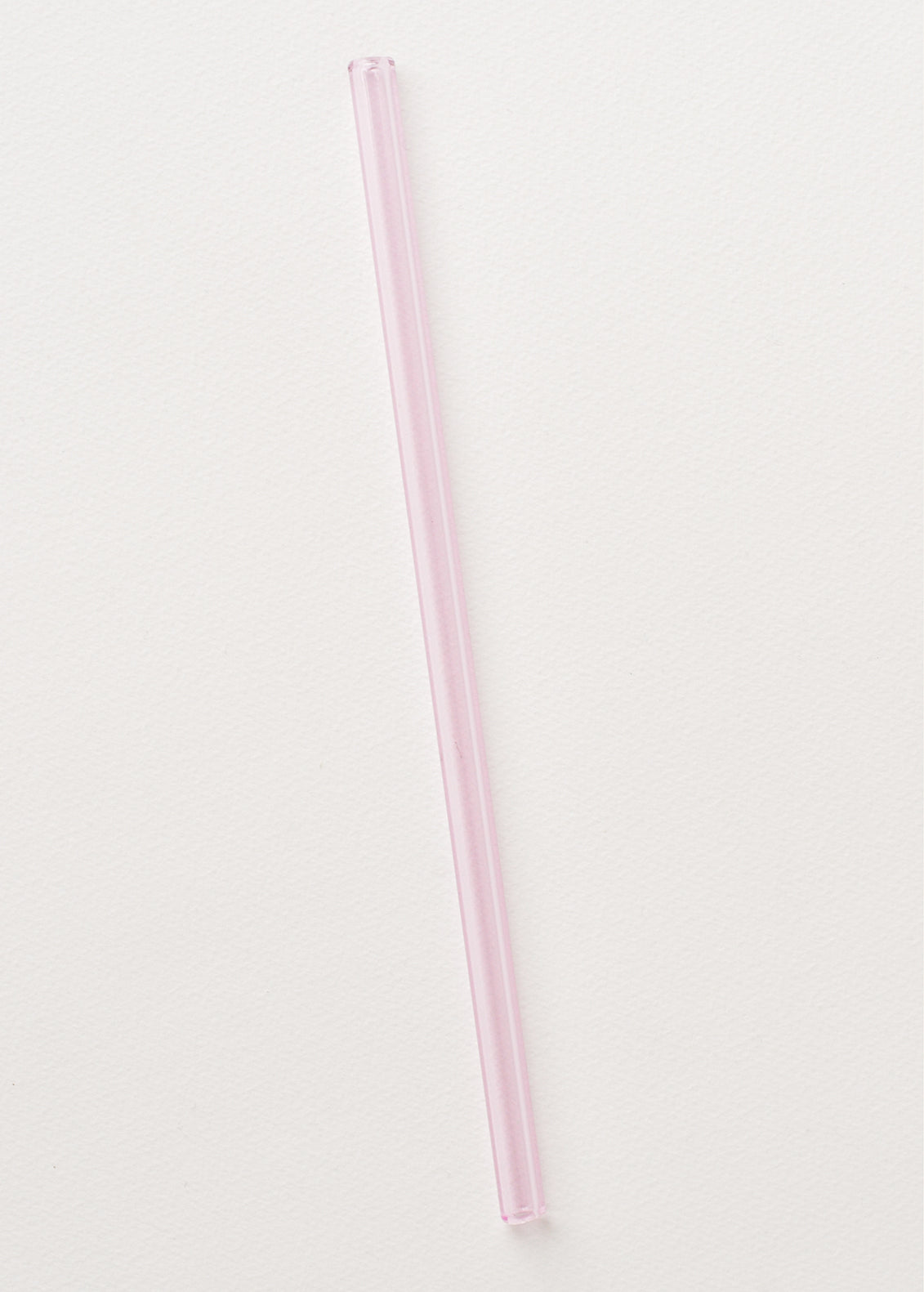 A light pink glass straw.