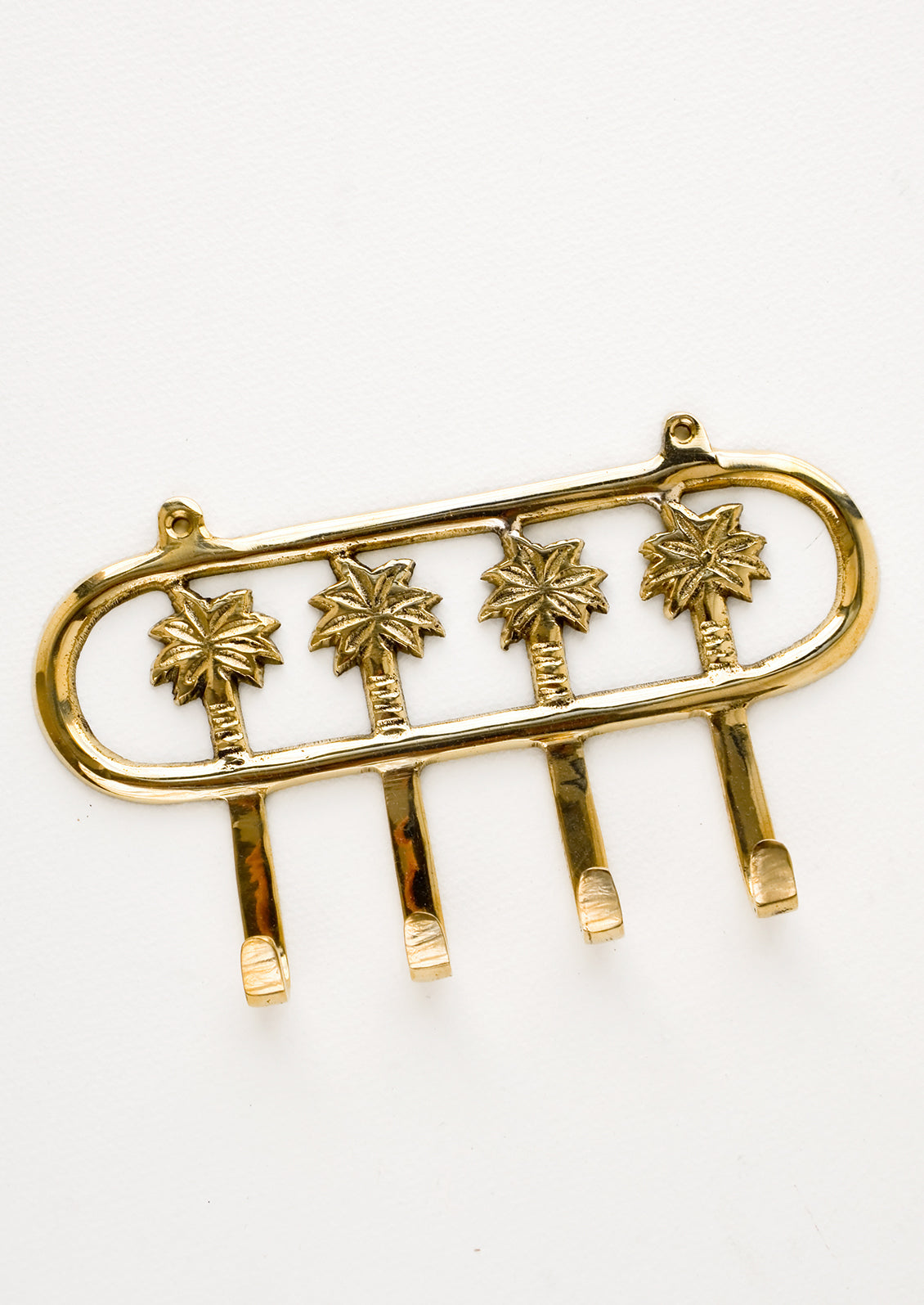 Wall mountable hook rack with 4 palm trees extending into hooks, made in brass