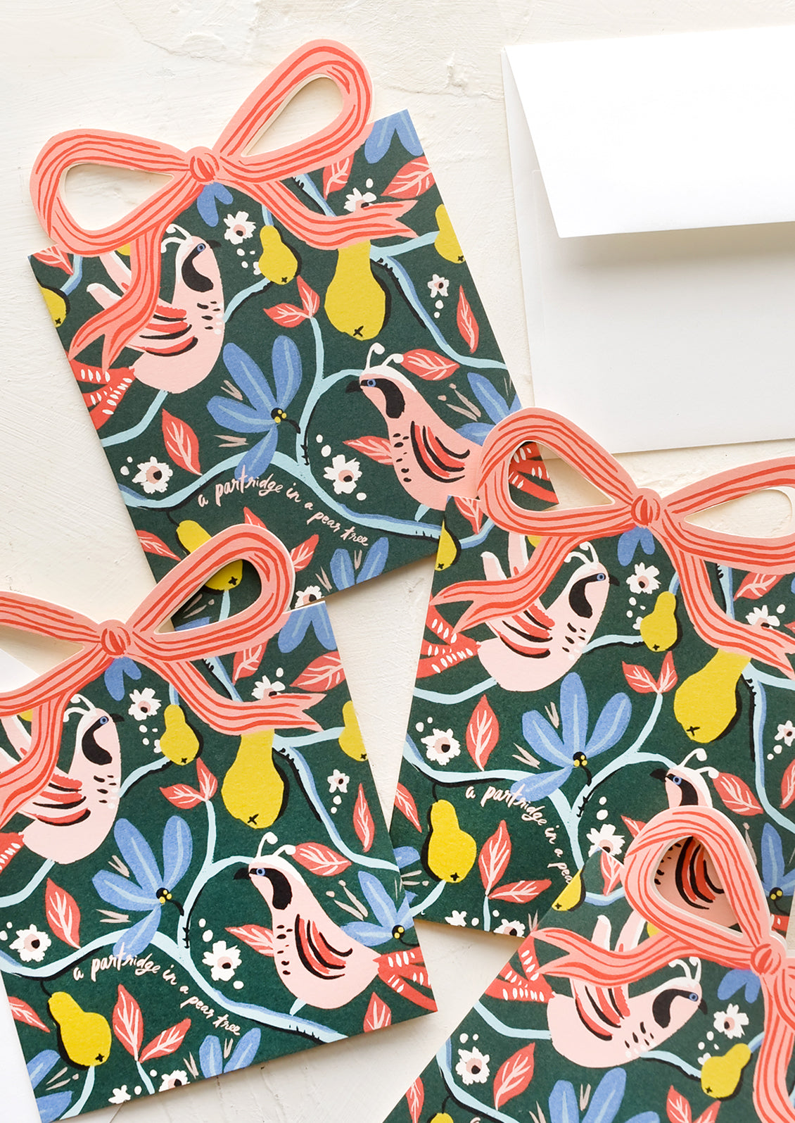 A set of present-shaped diecut cards with partridge design.