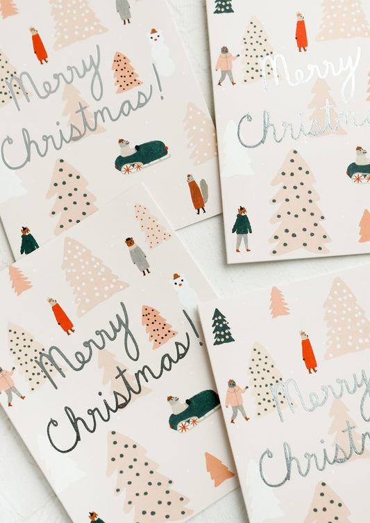 A greeting card set with animals surrounded by pink Christmas trees and silver text reads "Merry Christmas!".